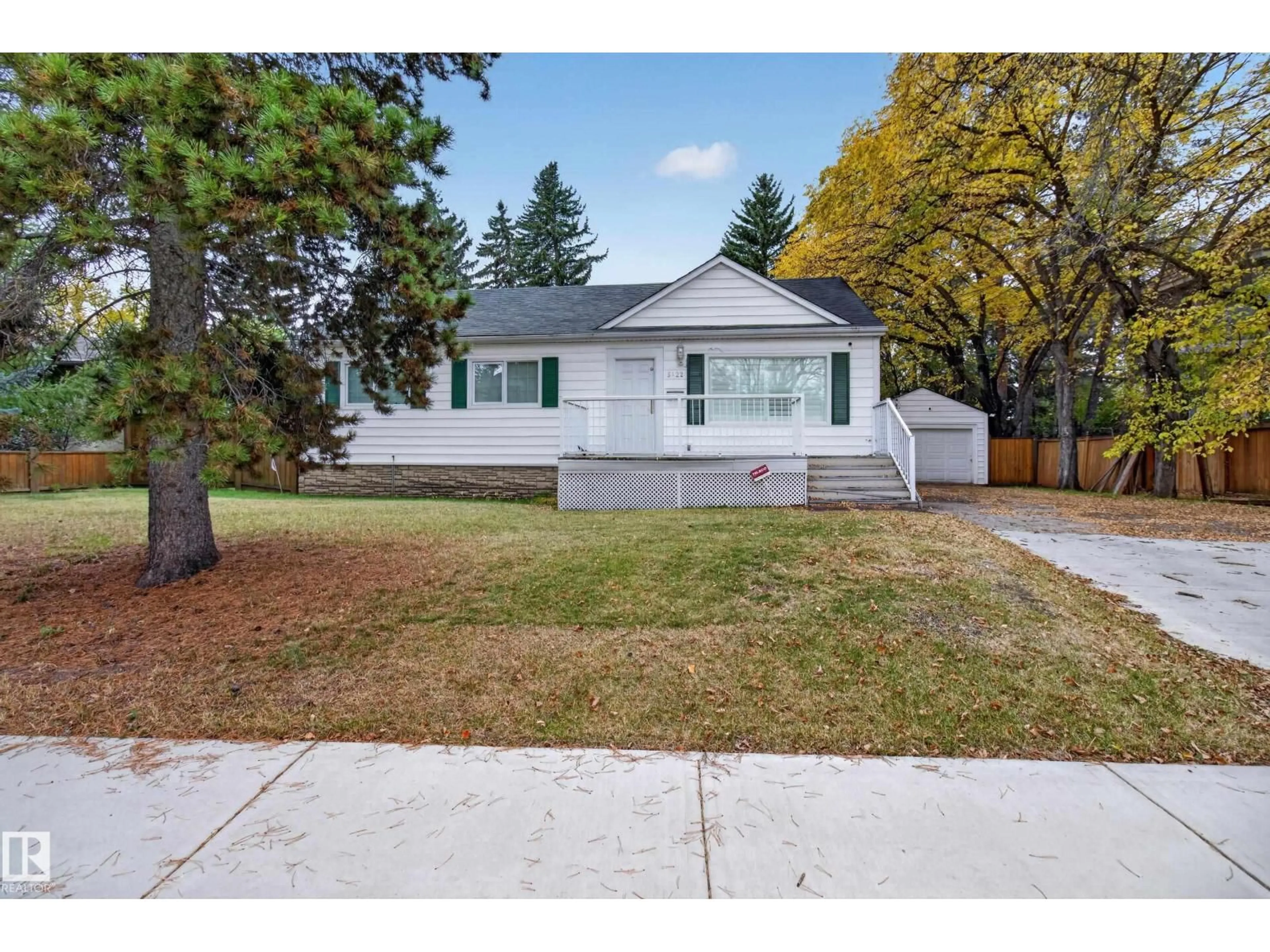 Home with vinyl exterior material, street for 5422 110 ST, Edmonton Alberta T6H3E1