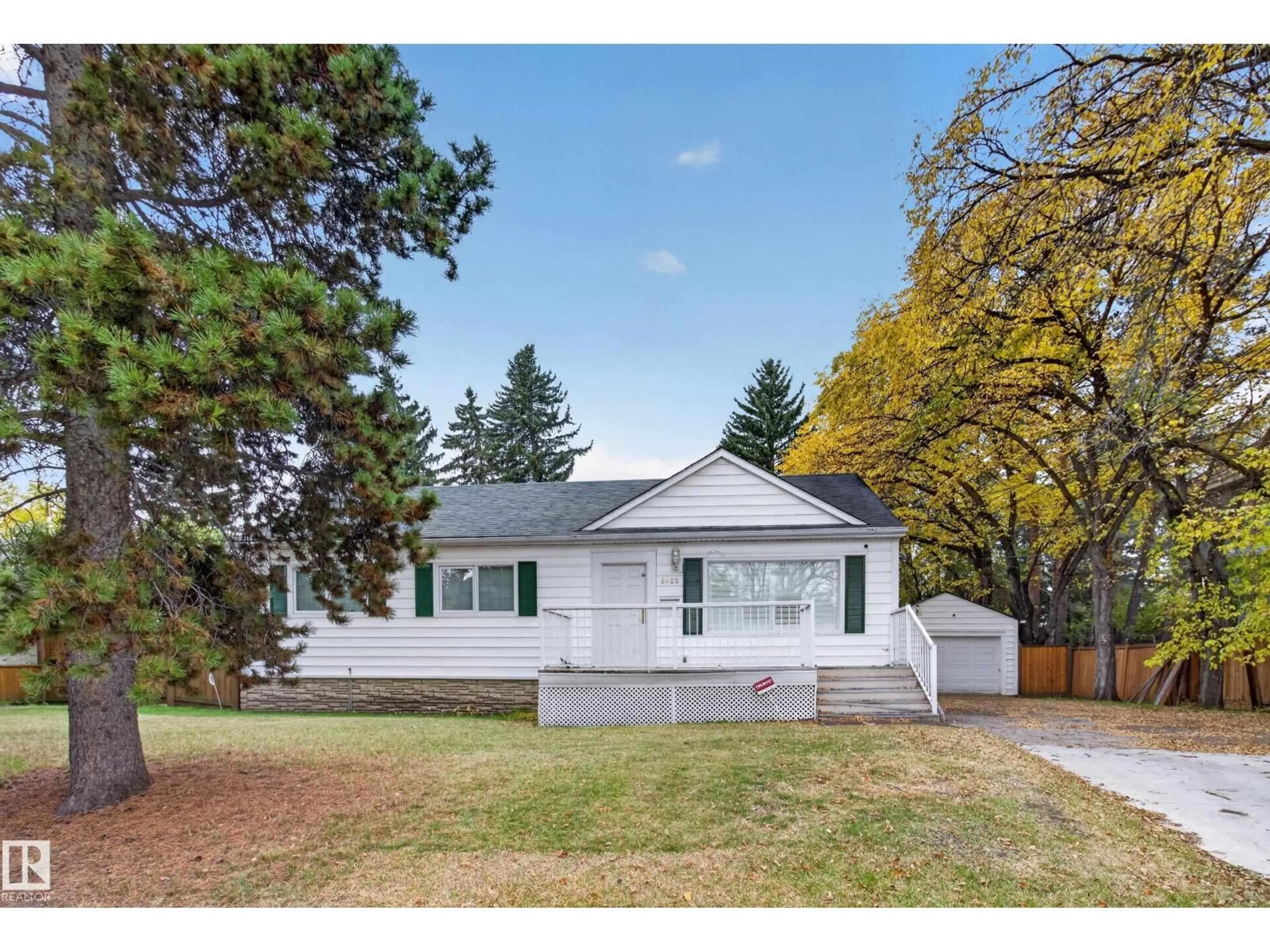 Home with vinyl exterior material, street for 5422 110 ST, Edmonton Alberta T6H3E1
