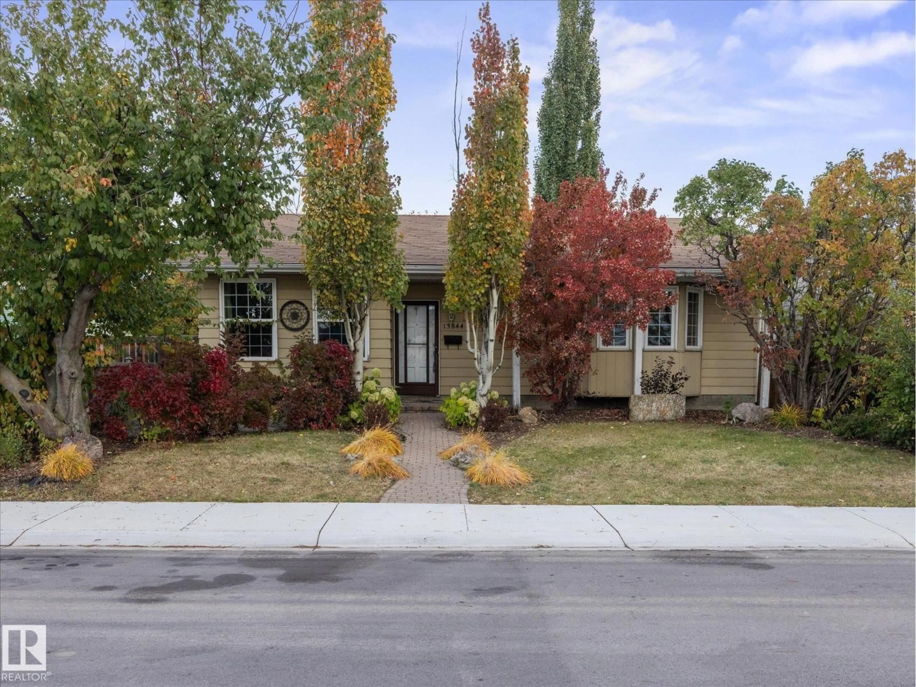 Home with vinyl exterior material, street for 13844 30 ST, Edmonton Alberta T5Y1M5