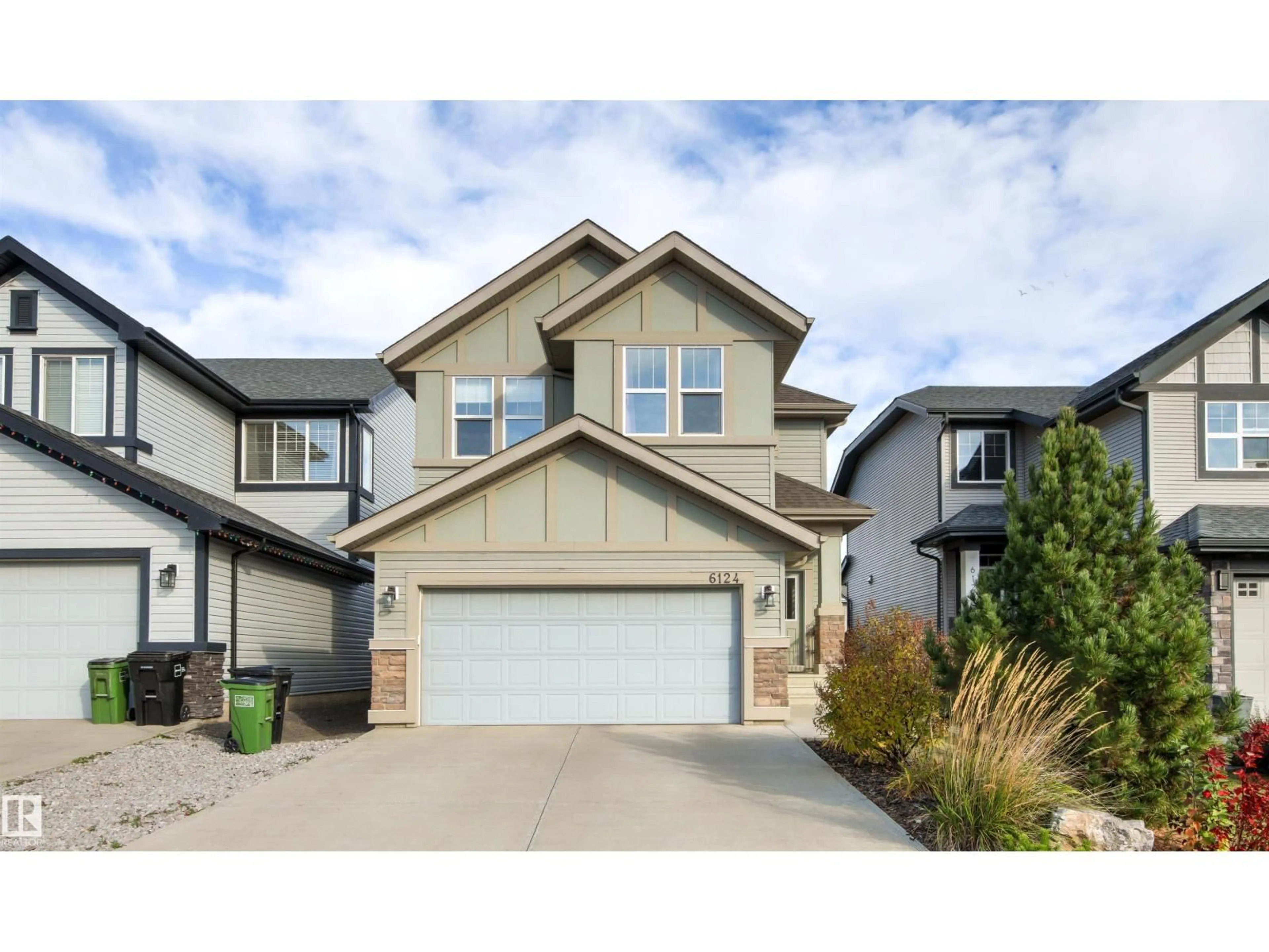 Home with vinyl exterior material, street for NW - 6124 175 AV, Edmonton Alberta T5Y3N7