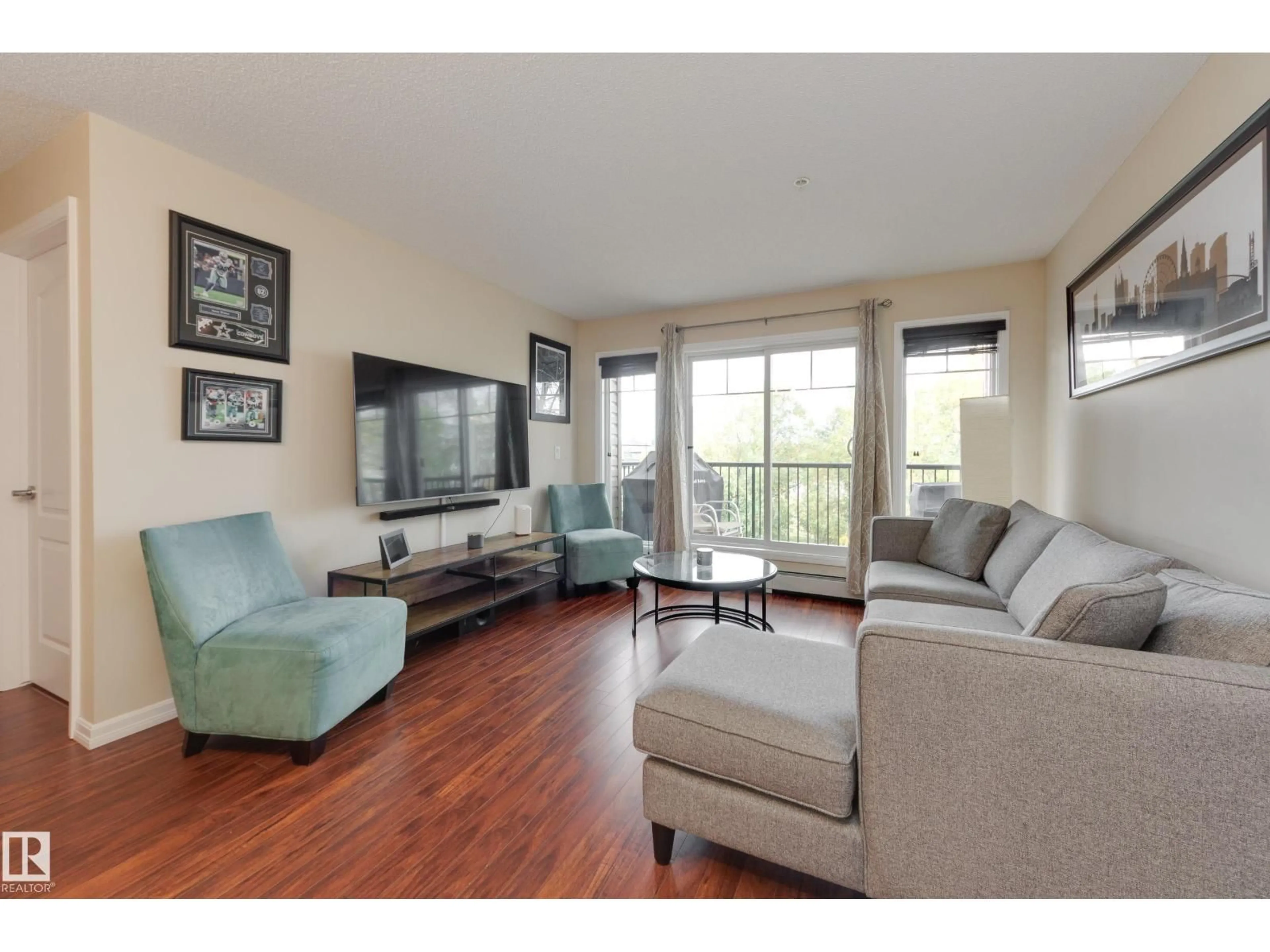 Living room with furniture, wood/laminate floor for 210 - #210 CHARLOTTE WY, Sherwood Park Alberta T8H0N9