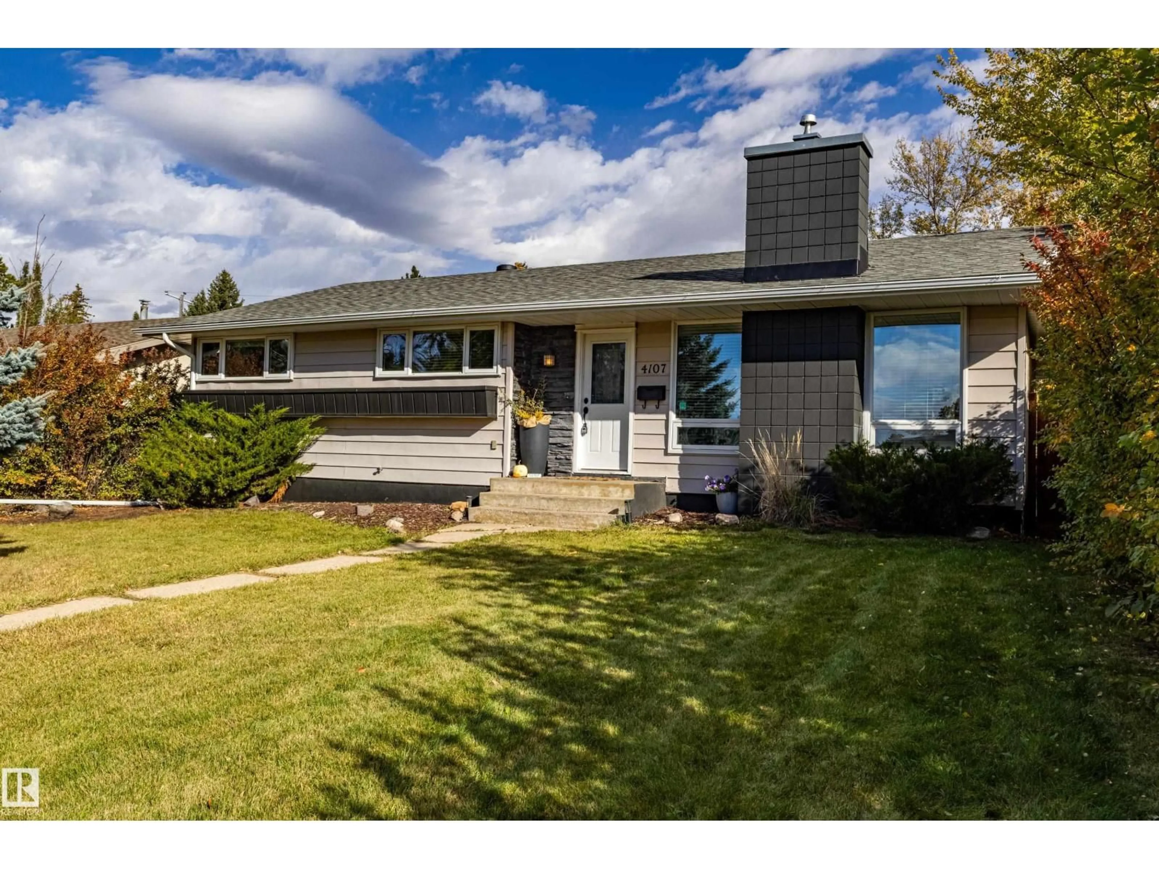 Home with vinyl exterior material, street for 4107 122 ST, Edmonton Alberta T6J1Z1