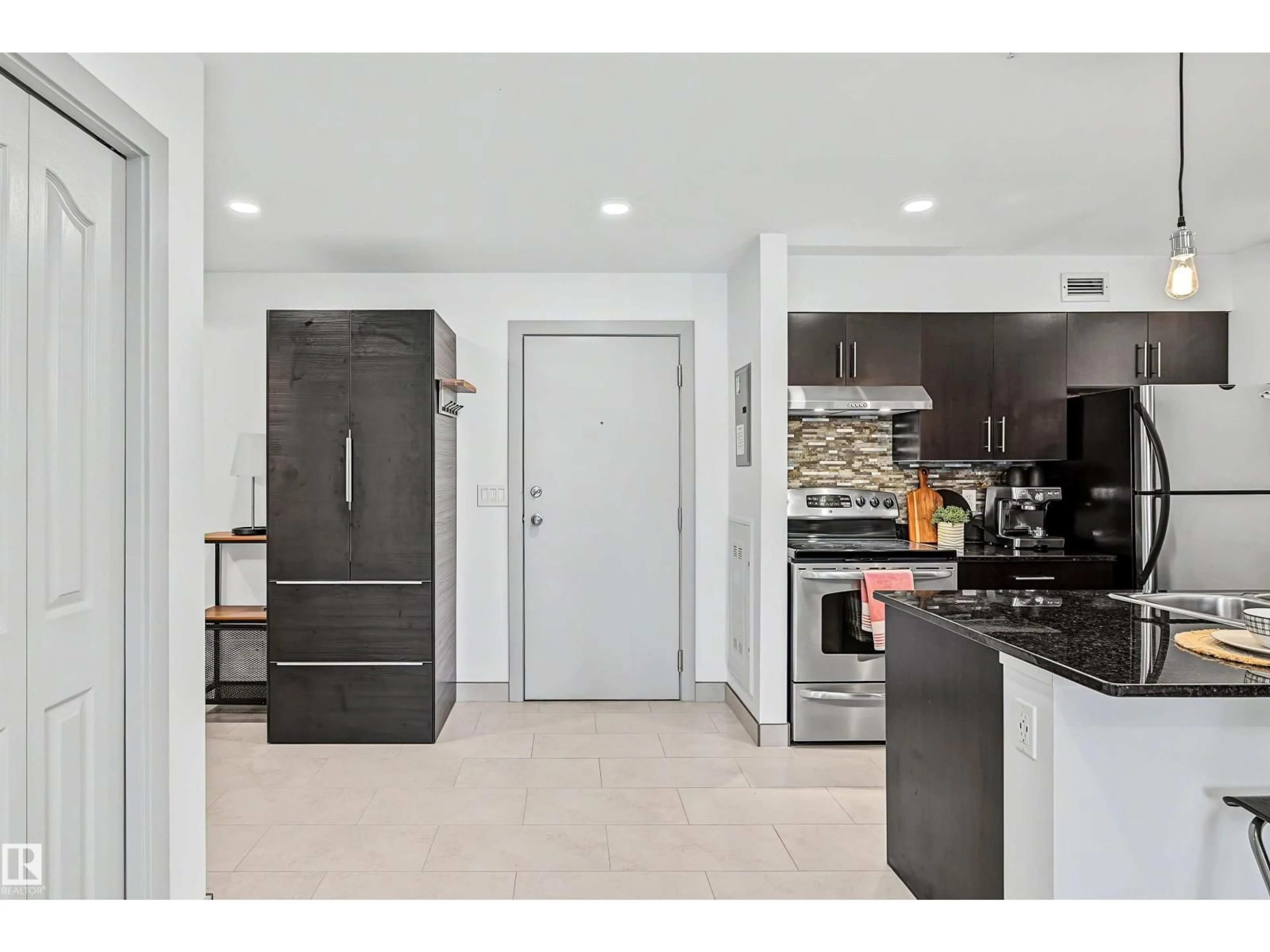 Open concept kitchen, ceramic/tile floor for #204 - 530 WATT BV, Edmonton Alberta T6X1P7