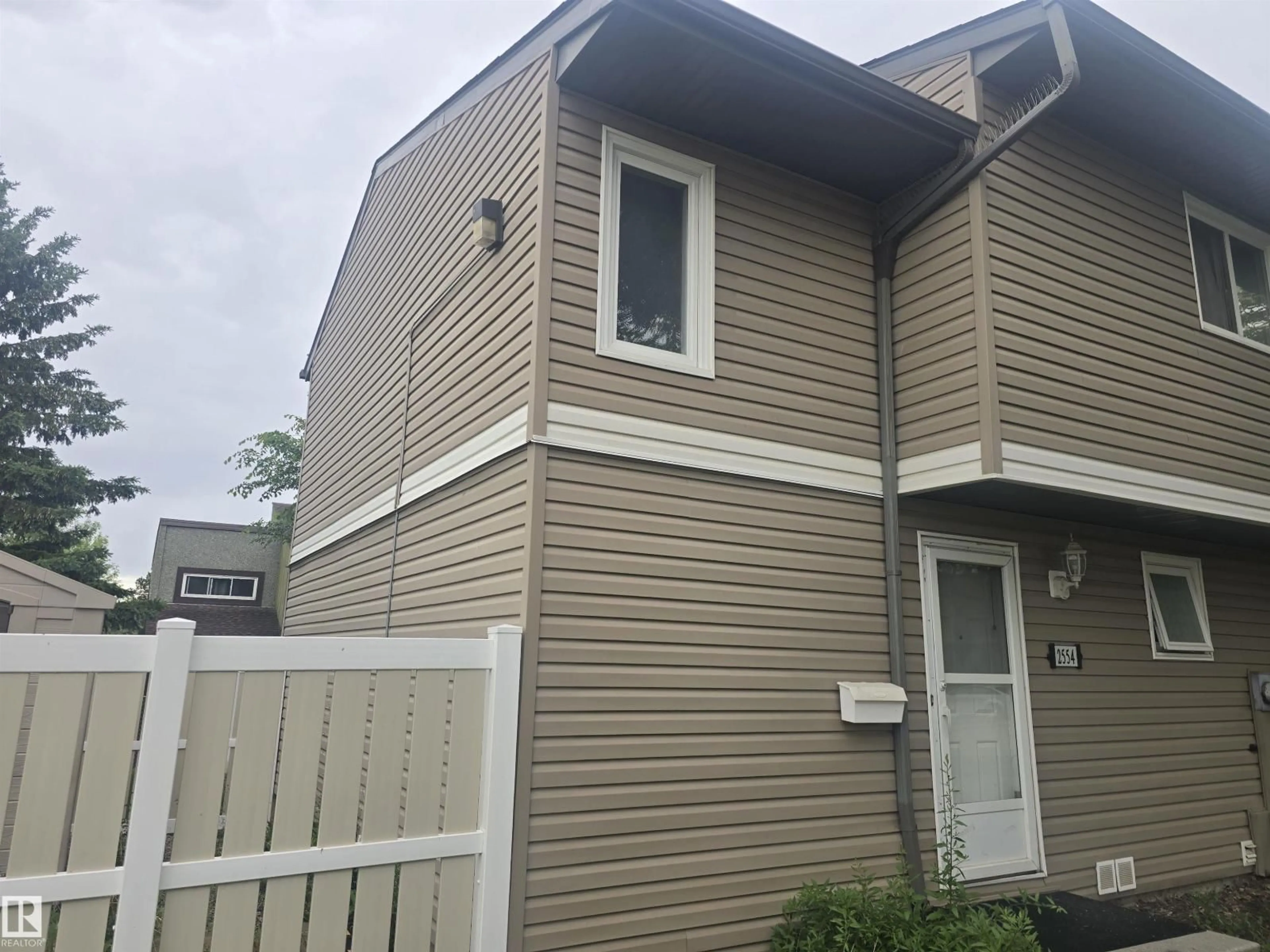 Home with vinyl exterior material, street for 2554 79 ST, Edmonton Alberta T6K3Y4