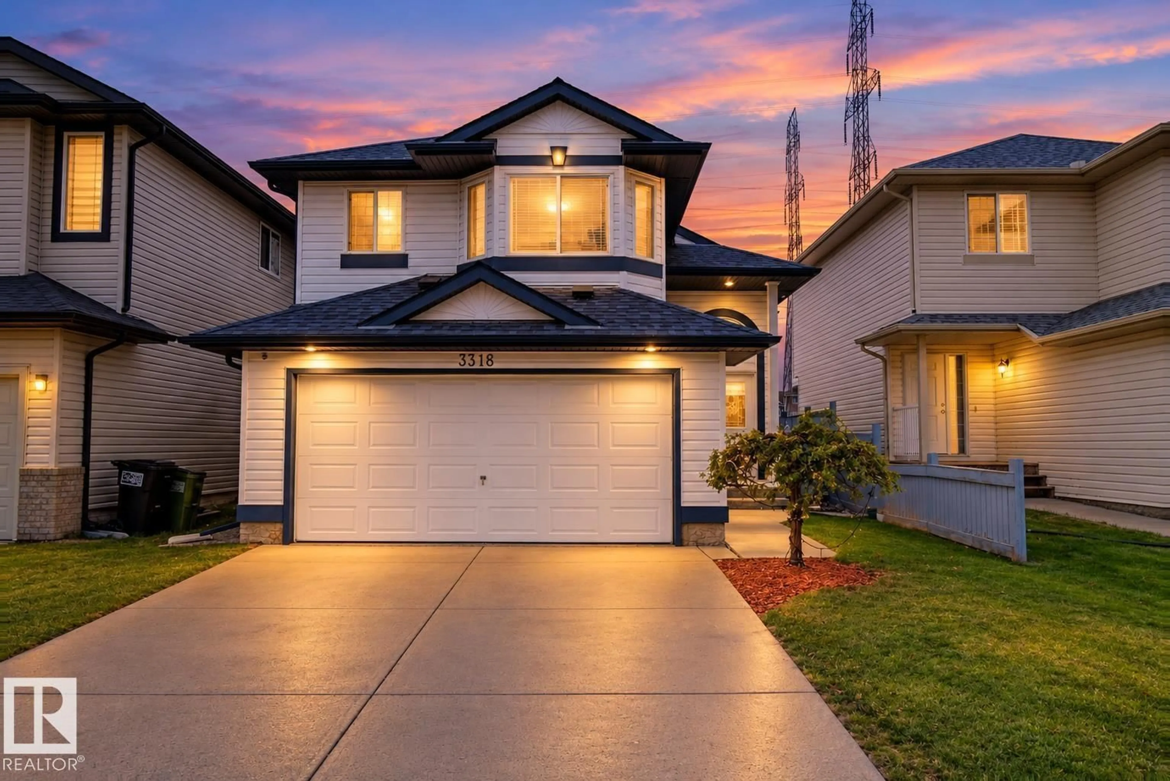 Home with vinyl exterior material, street for 3316 26 ST, Edmonton Alberta T6T1Z3