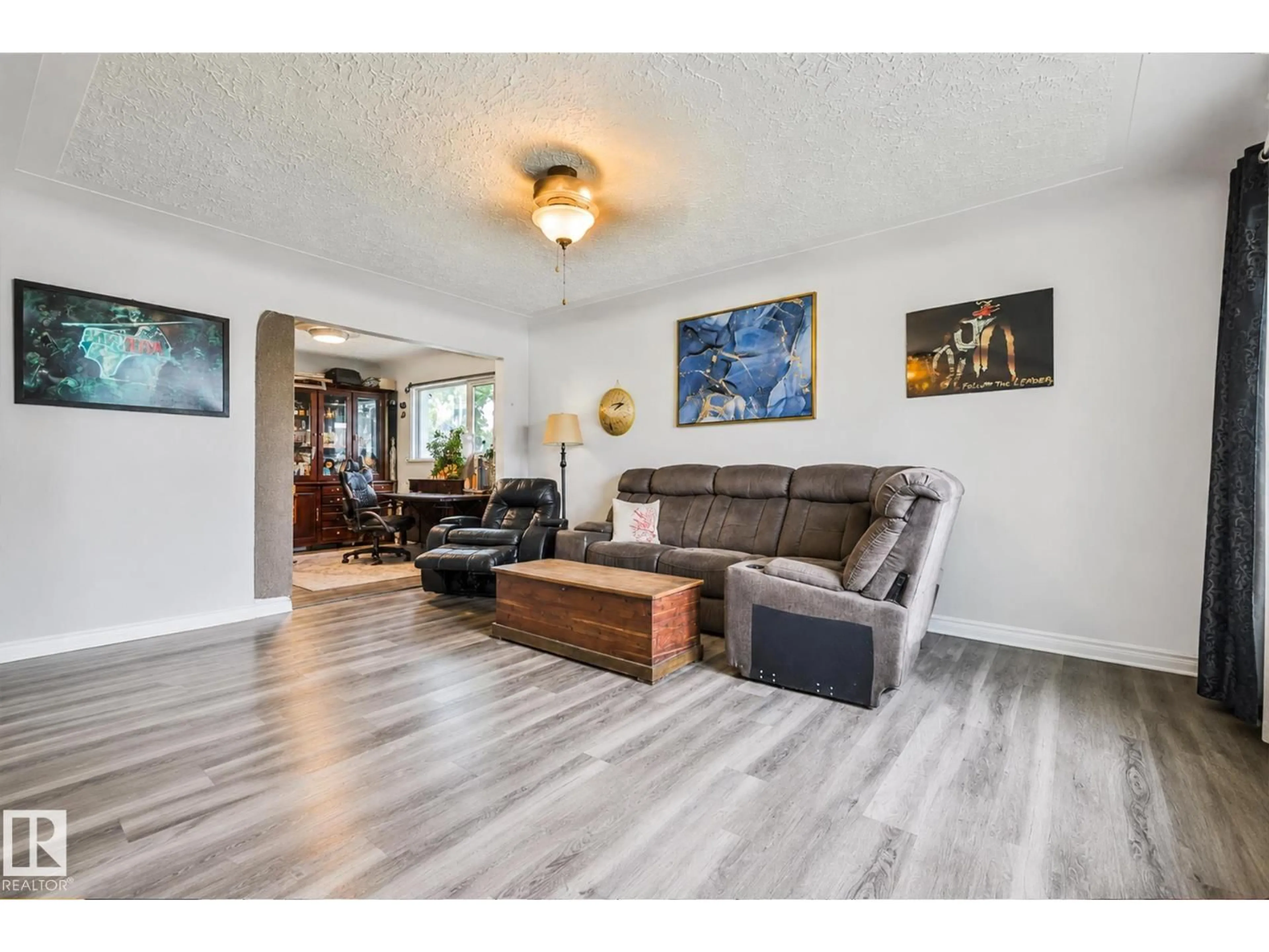Living room with furniture, wood/laminate floor for 11404 127 AV, Edmonton Alberta T5E0C6