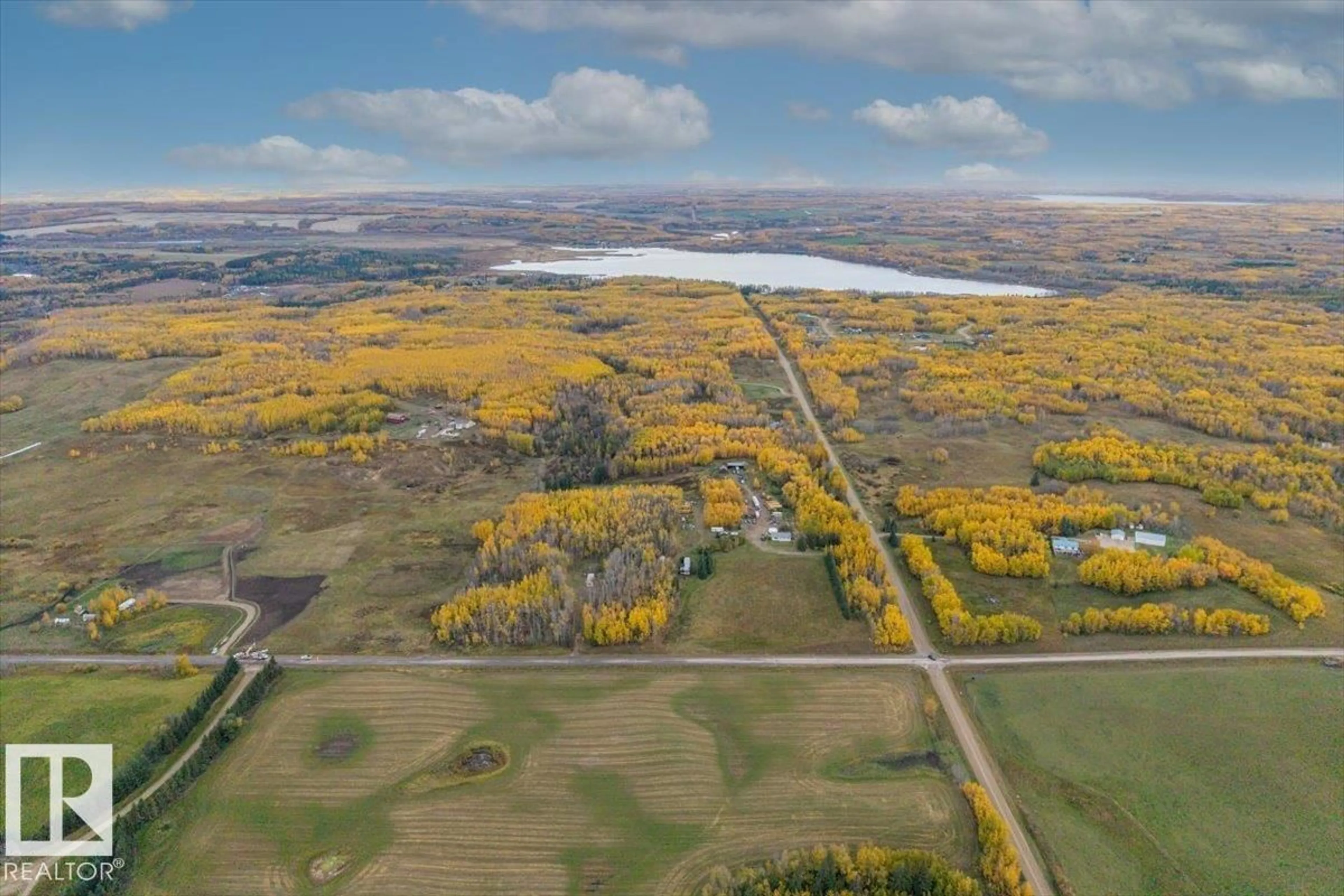 A pic from outside/outdoor area/front of a property/back of a property/a pic from drone, water/lake/river/ocean view for 54404 RR 14, Rural Lac Ste. Anne County Alberta T0E1V0