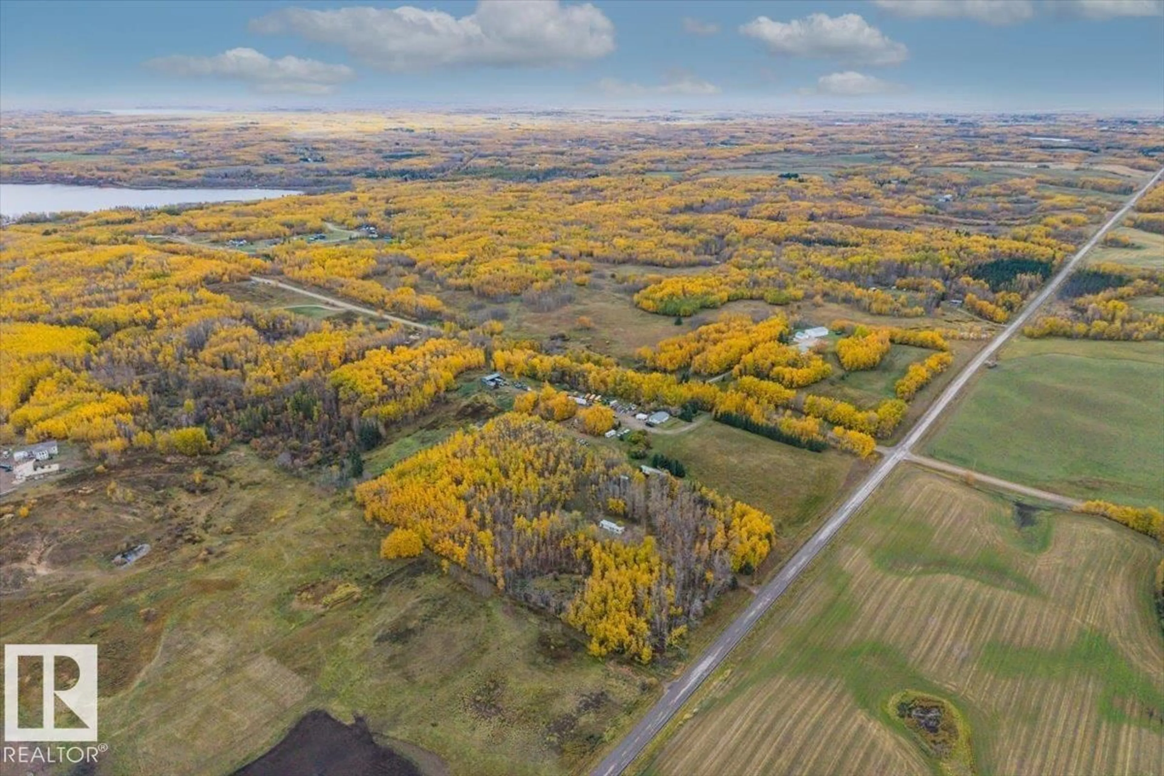 A pic from outside/outdoor area/front of a property/back of a property/a pic from drone, water/lake/river/ocean view for 54404 RR 14, Rural Lac Ste. Anne County Alberta T0E1V0