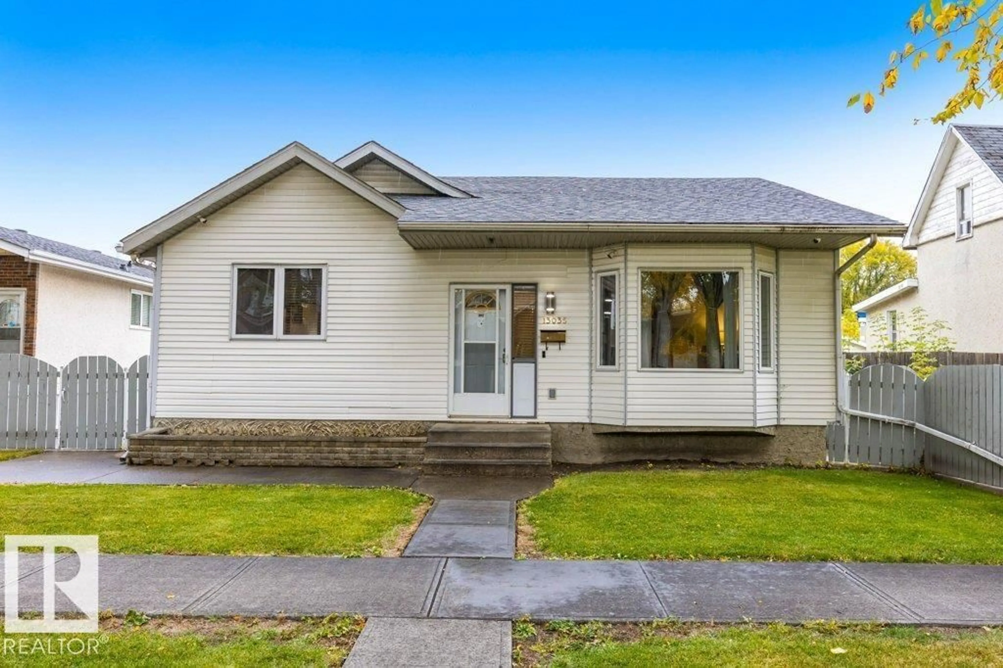 Home with vinyl exterior material, street for 13035 117 ST, Edmonton Alberta T5E5J9