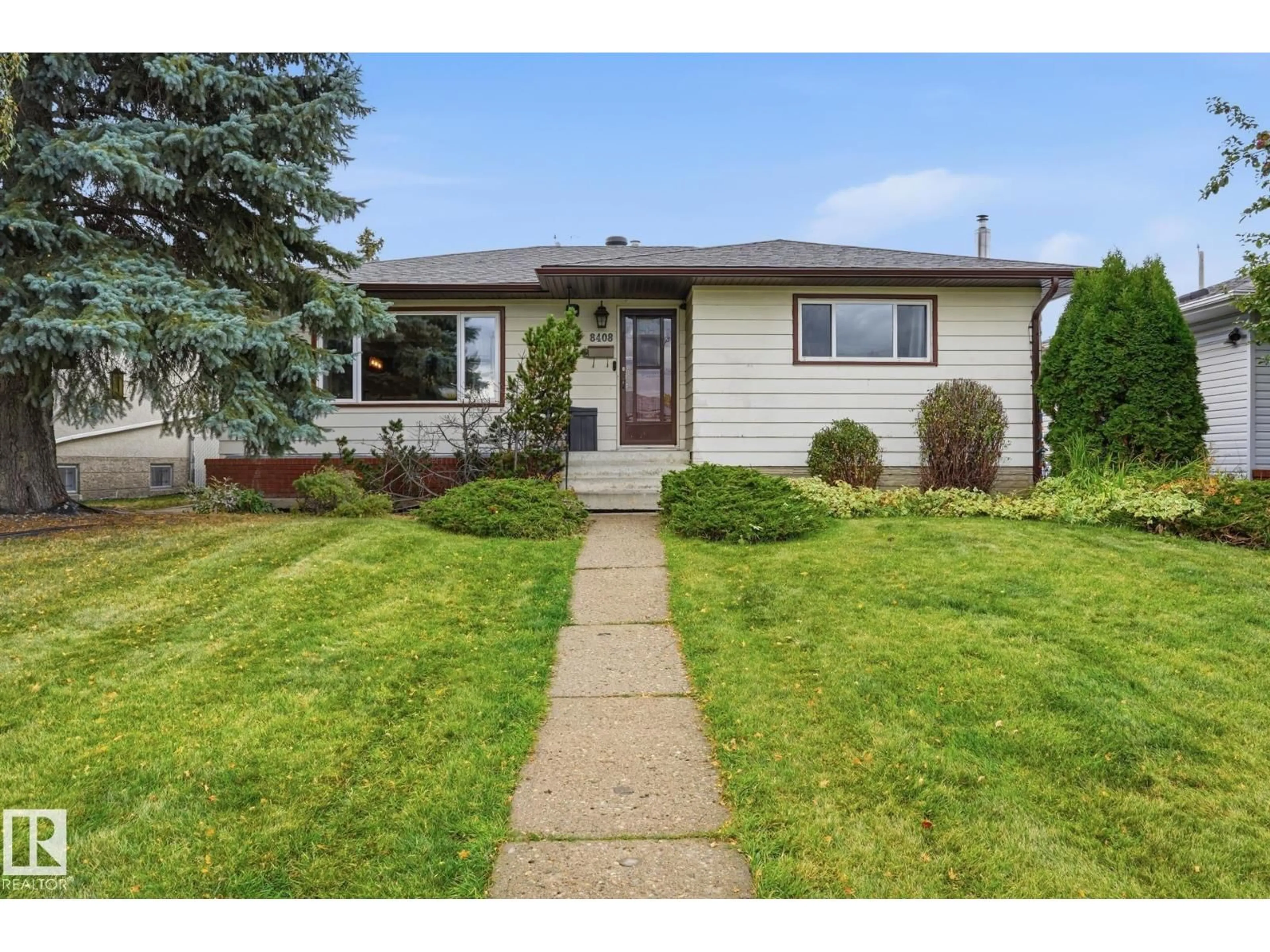 Home with vinyl exterior material, street for 8408 54 ST, Edmonton Alberta T6B1H1
