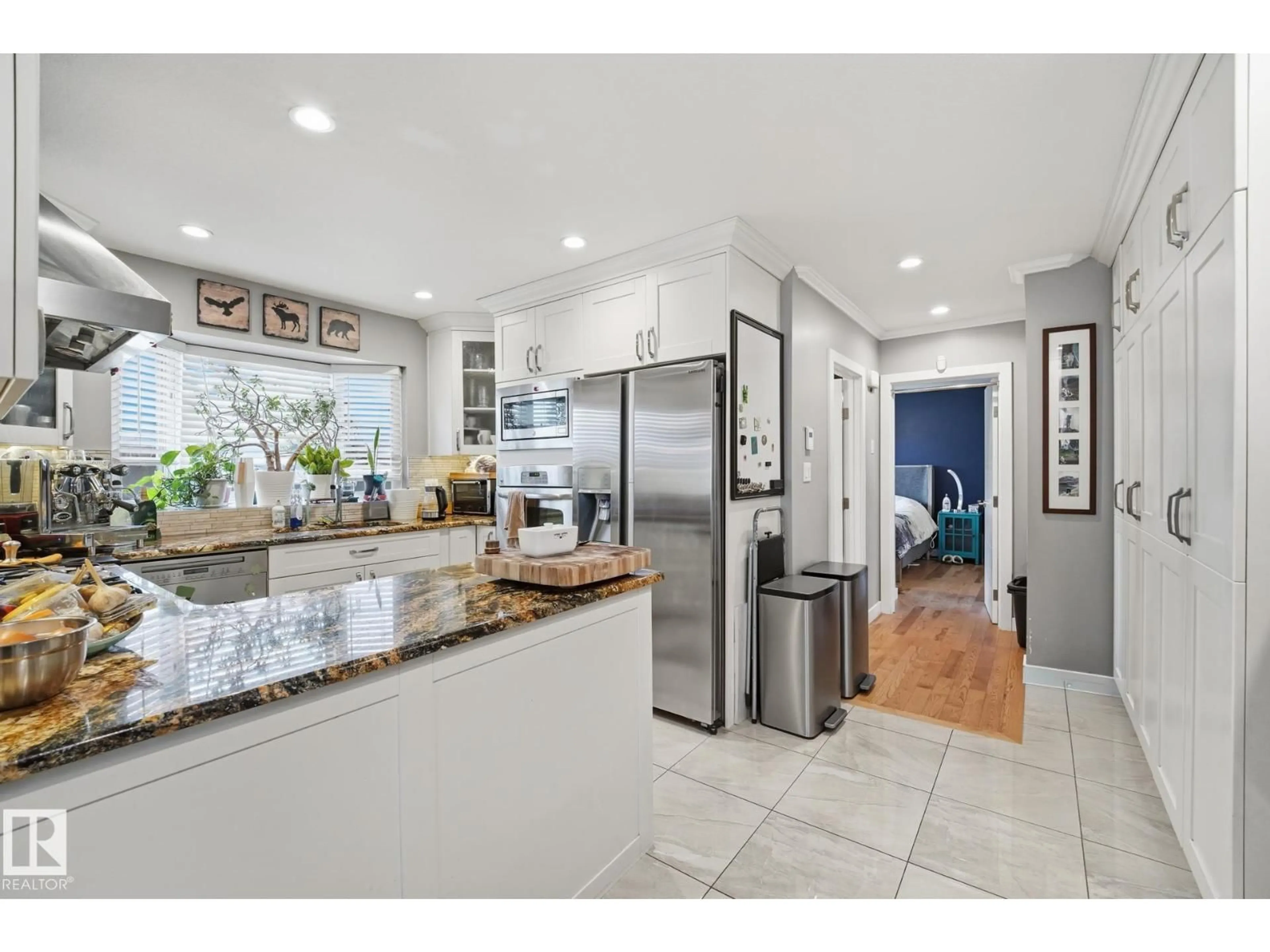 Open concept kitchen, ceramic/tile floor for 8408 54 ST, Edmonton Alberta T6B1H1