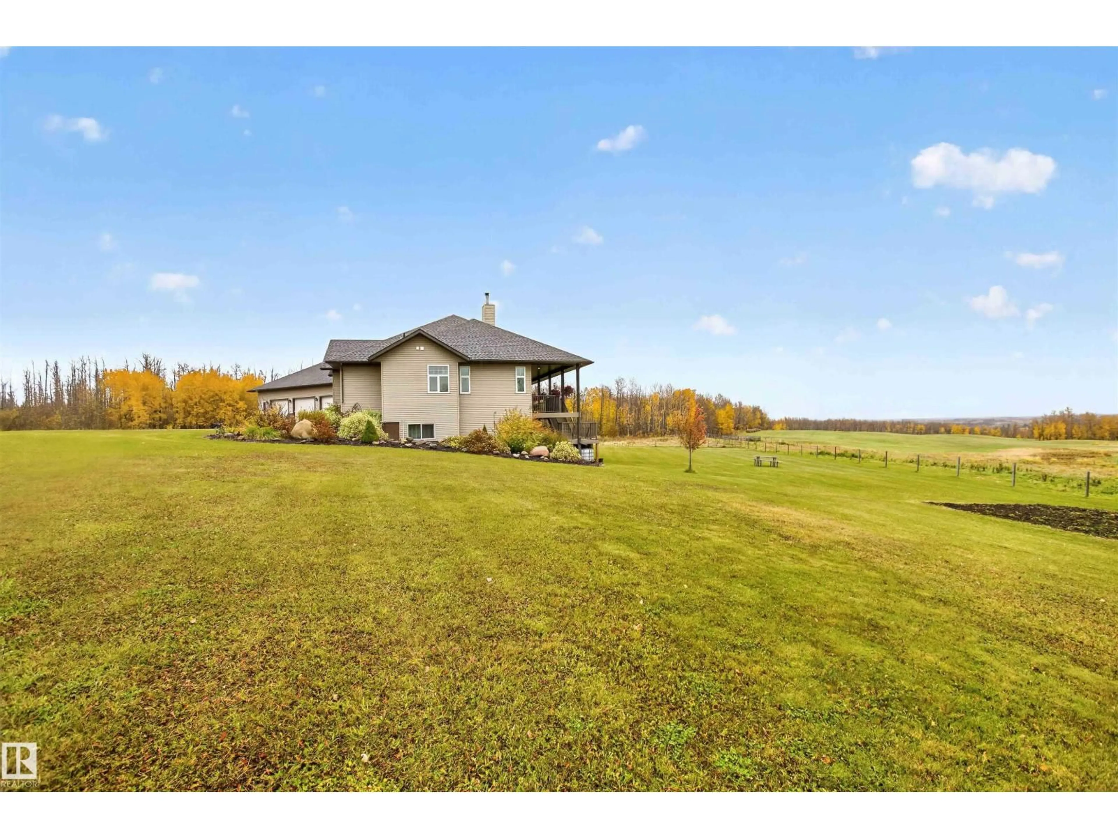 A pic from outside/outdoor area/front of a property/back of a property/a pic from drone, water/lake/river/ocean view for 57111 HWY 757, Rural Lac Ste. Anne County Alberta T0E2A0