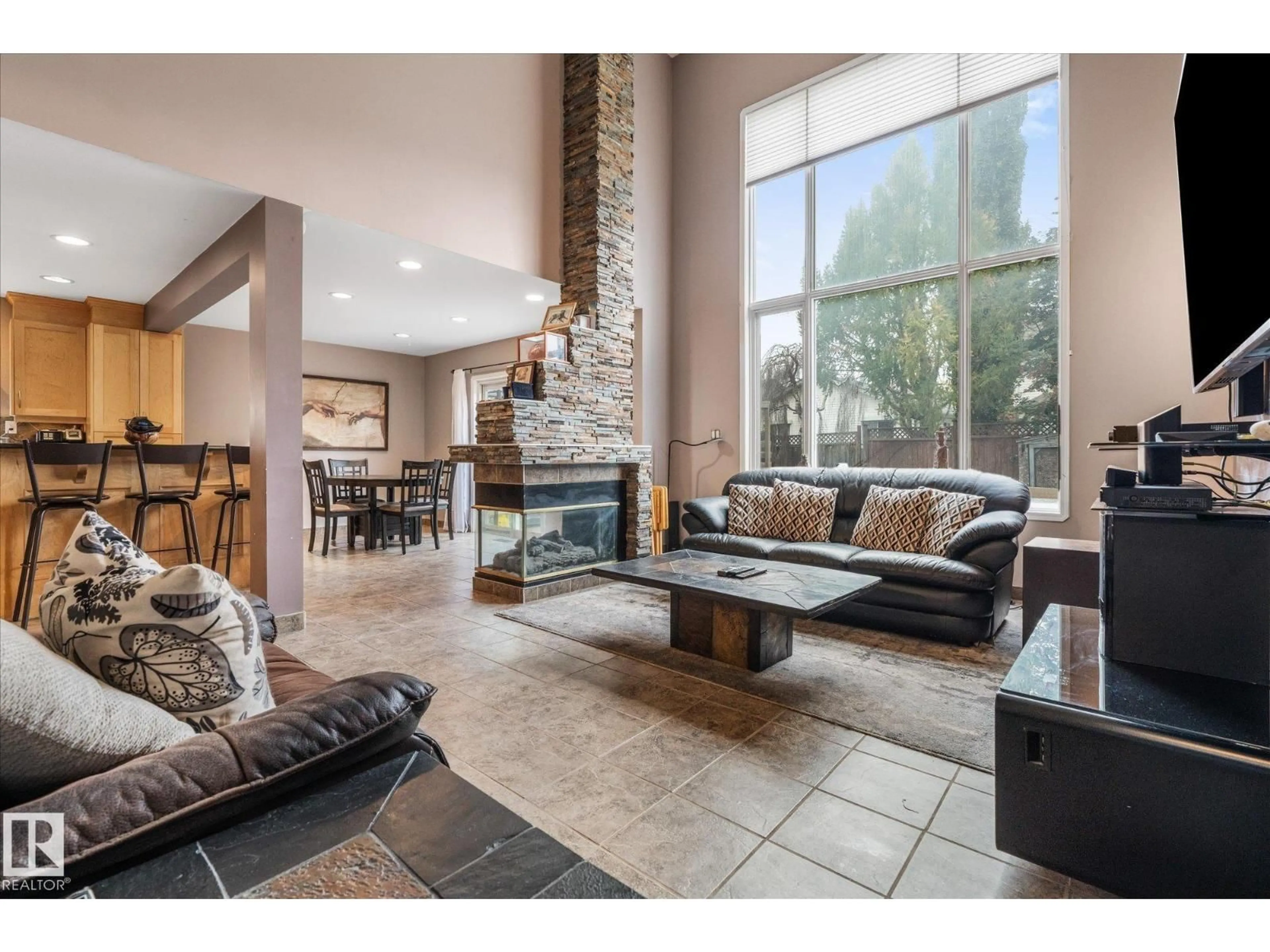 Living room with furniture, ceramic/tile floor for 407 BRECKENRIDGE LN, Edmonton Alberta T5T6E3
