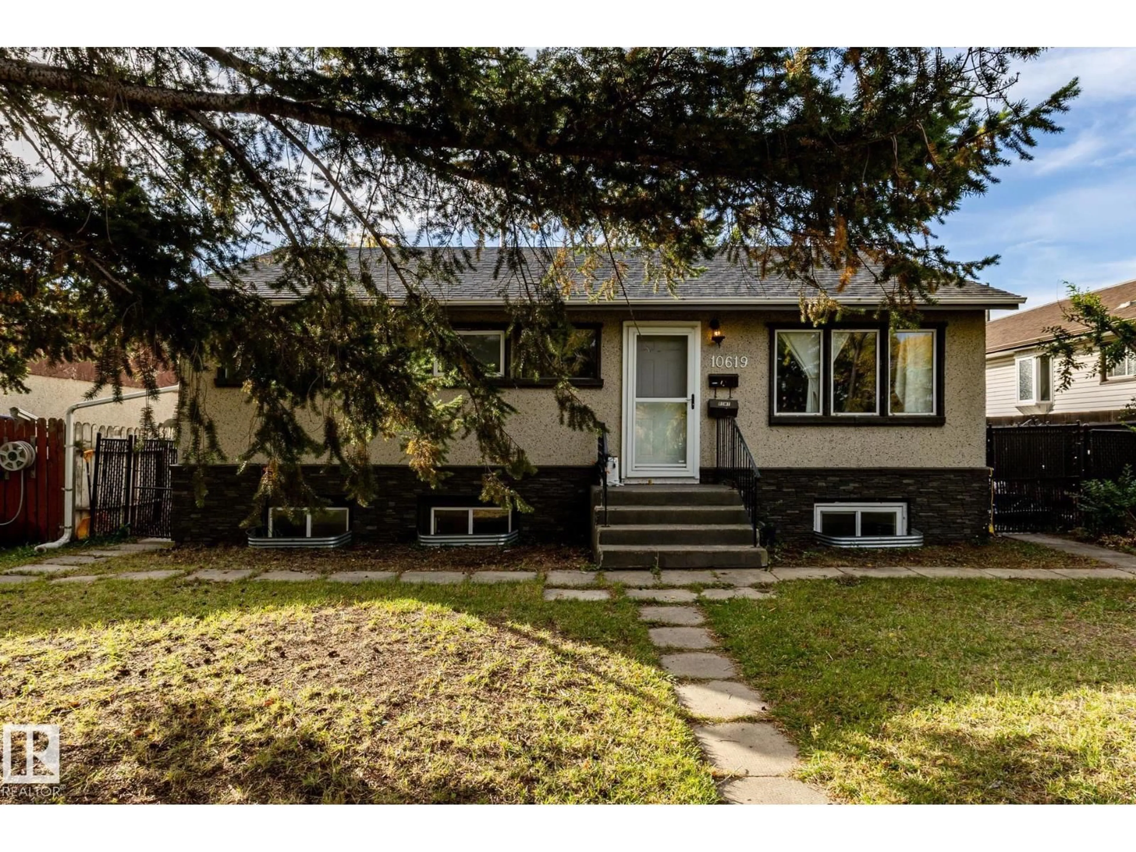 Home with vinyl exterior material, street for 10619 129 AV, Edmonton Alberta T5E0L3