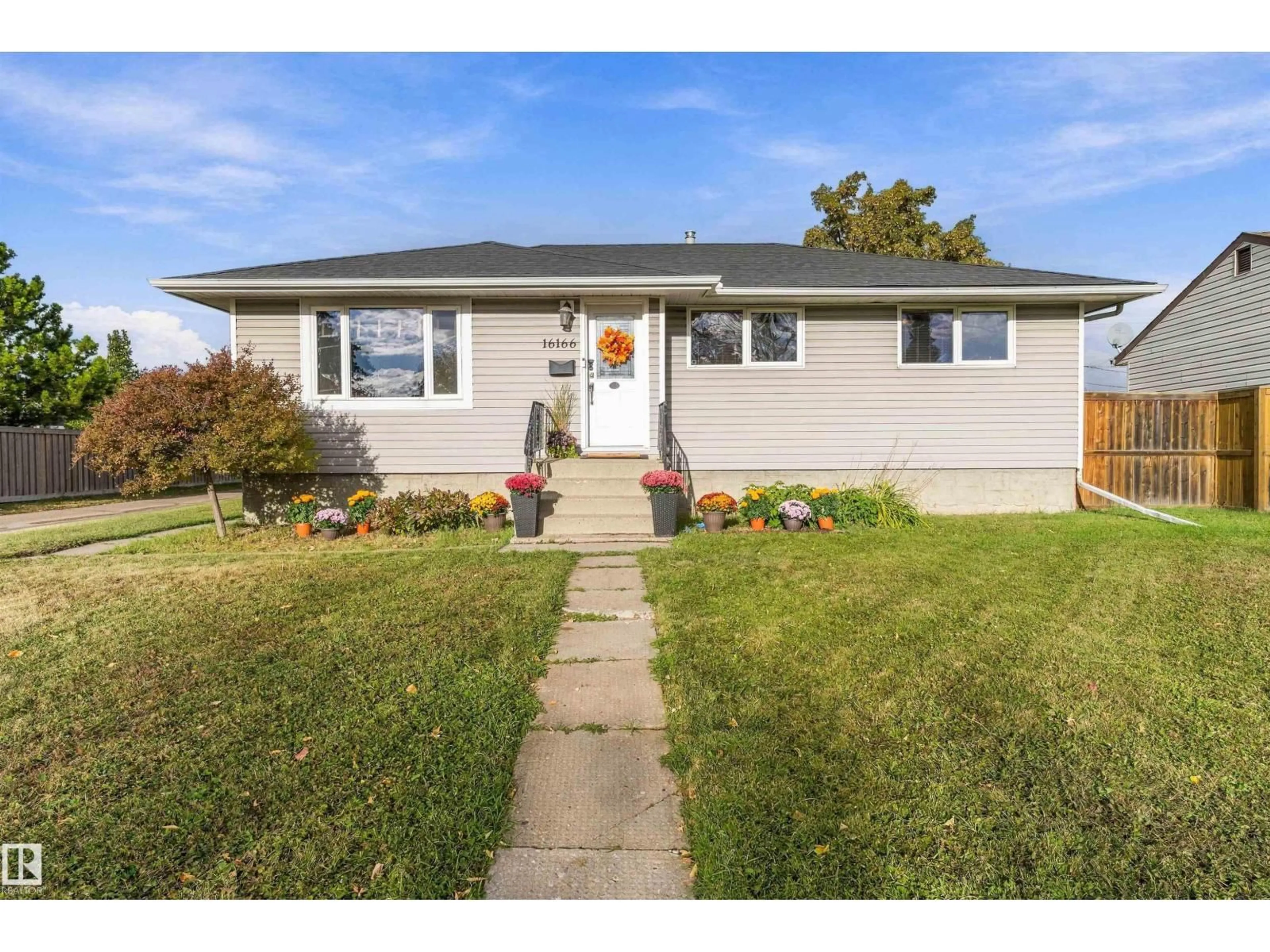Home with vinyl exterior material, street for NW - 16166 110 A AV, Edmonton Alberta T5P1J1
