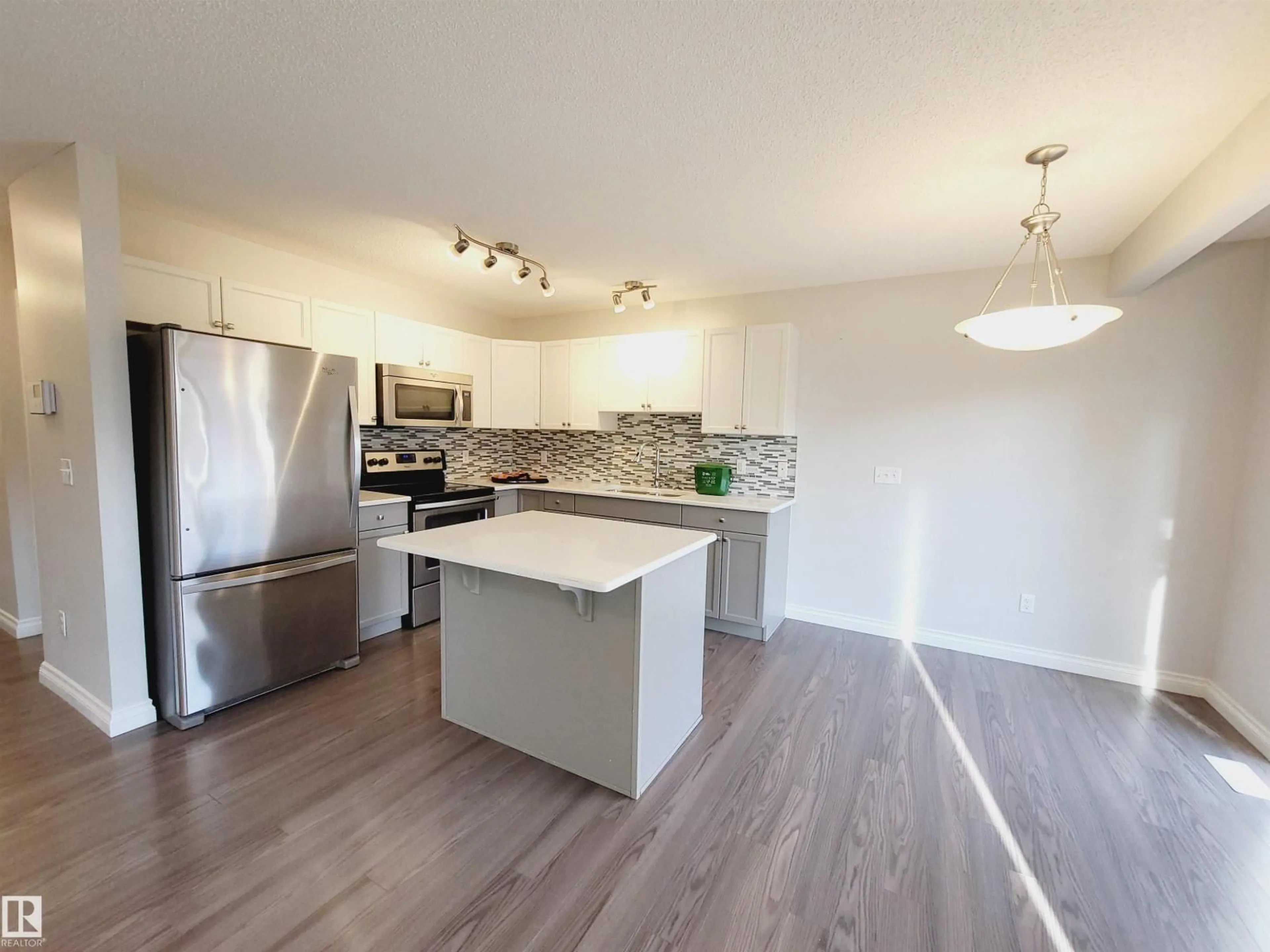 Open concept kitchen, wood/laminate floor for 25 - 445 BRINTNELL BV, Edmonton Alberta T5Y0V5