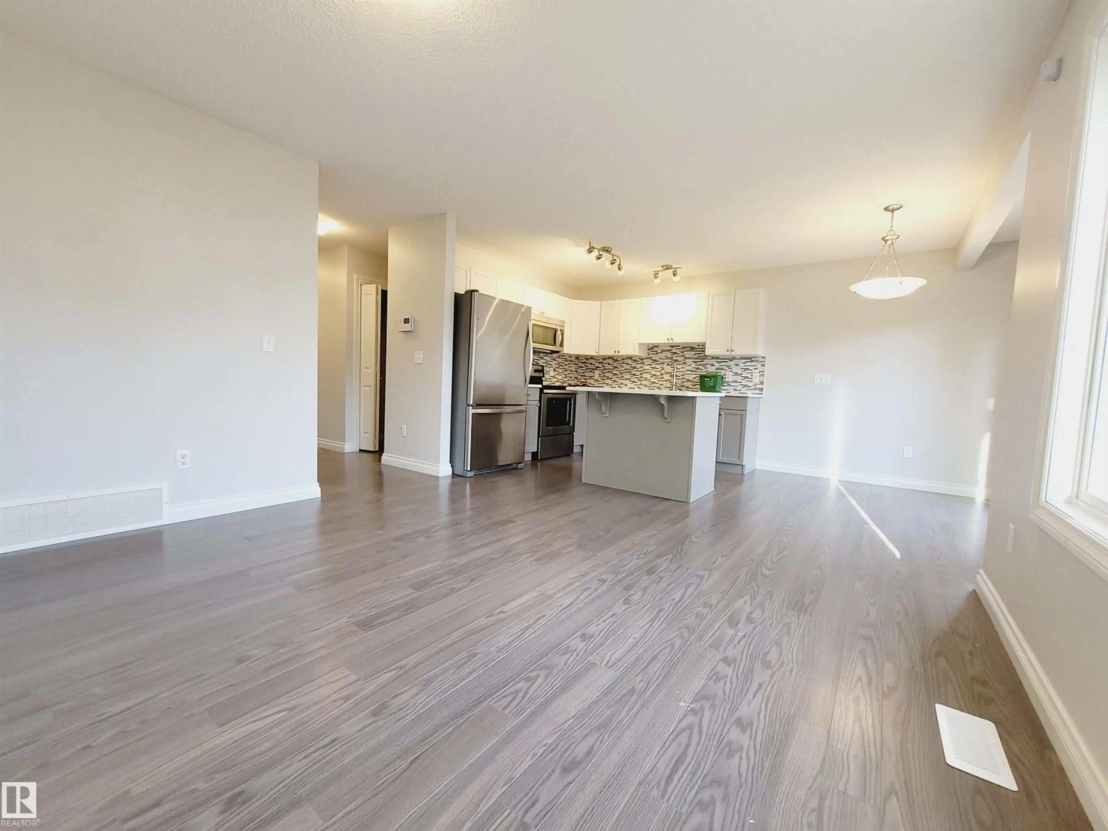 Open concept kitchen, wood/laminate floor for 25 - 445 BRINTNELL BV, Edmonton Alberta T5Y0V5