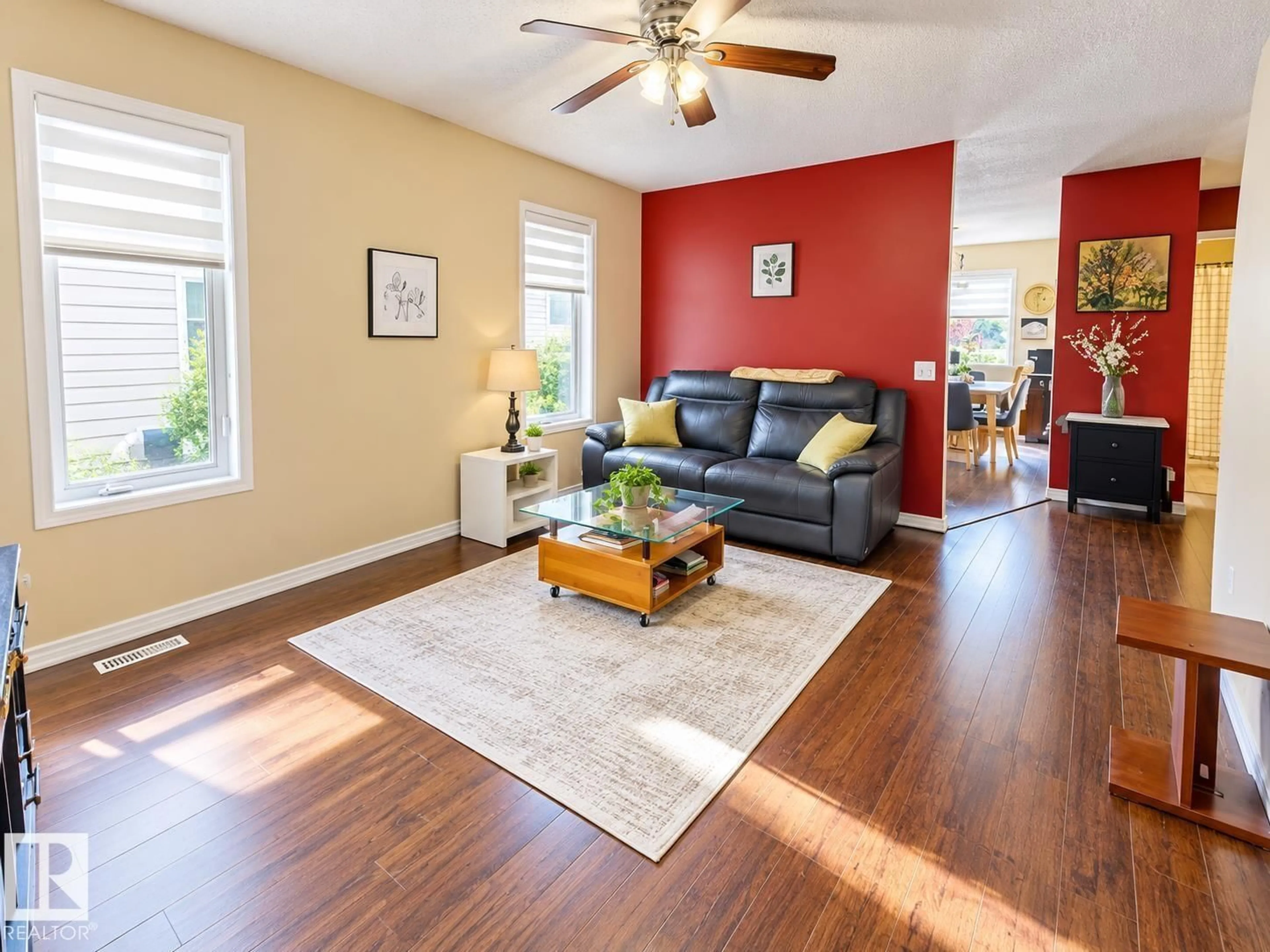 Living room with furniture, wood/laminate floor for NW - 15135 43 ST, Edmonton Alberta T5Y3B3