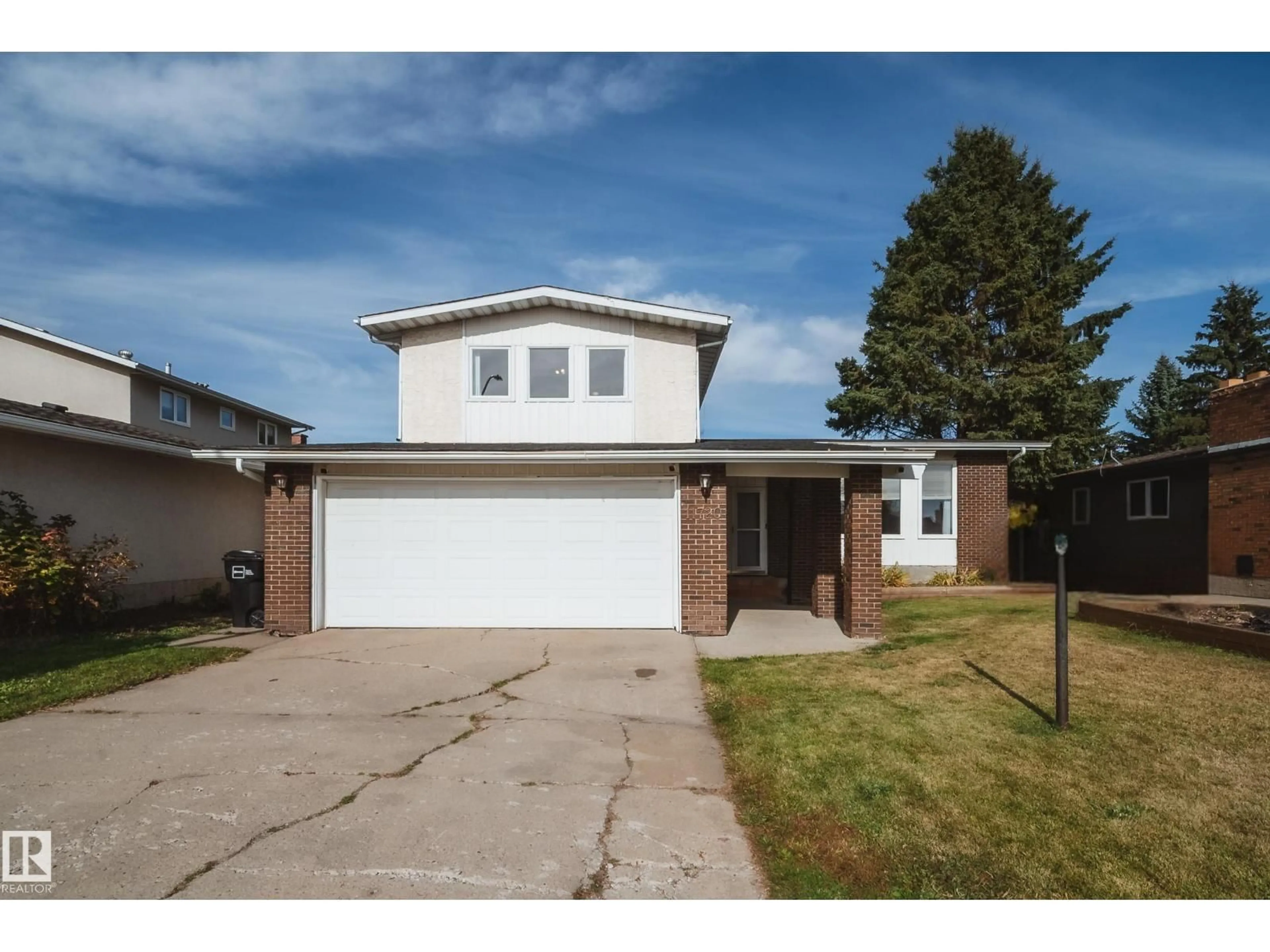 Home with vinyl exterior material, street for 11720 158 AV, Edmonton Alberta T5X2K4