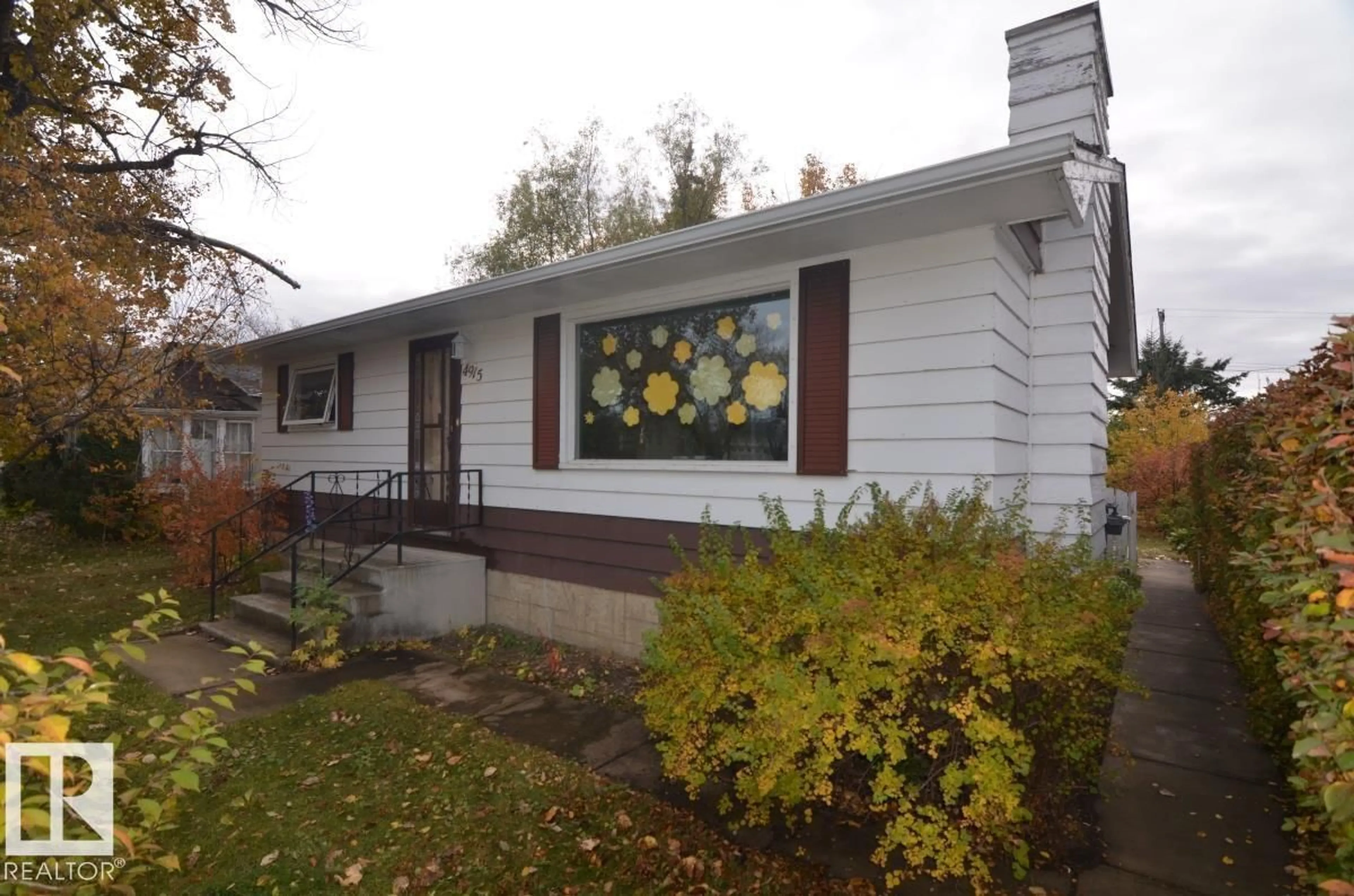Home with vinyl exterior material, street for 4915 53 AV, Tofield Alberta T0B4J0