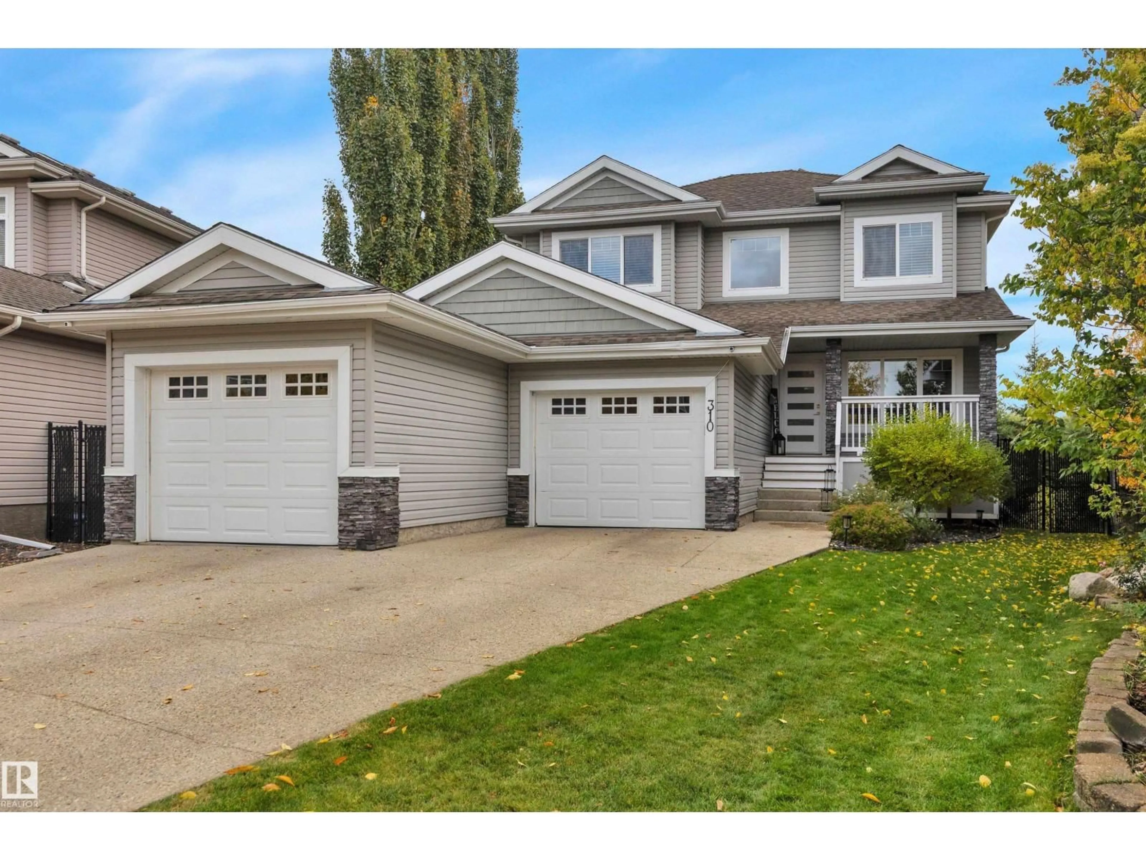 Home with vinyl exterior material, street for 310 ASH CL, Leduc Alberta T9E0E2