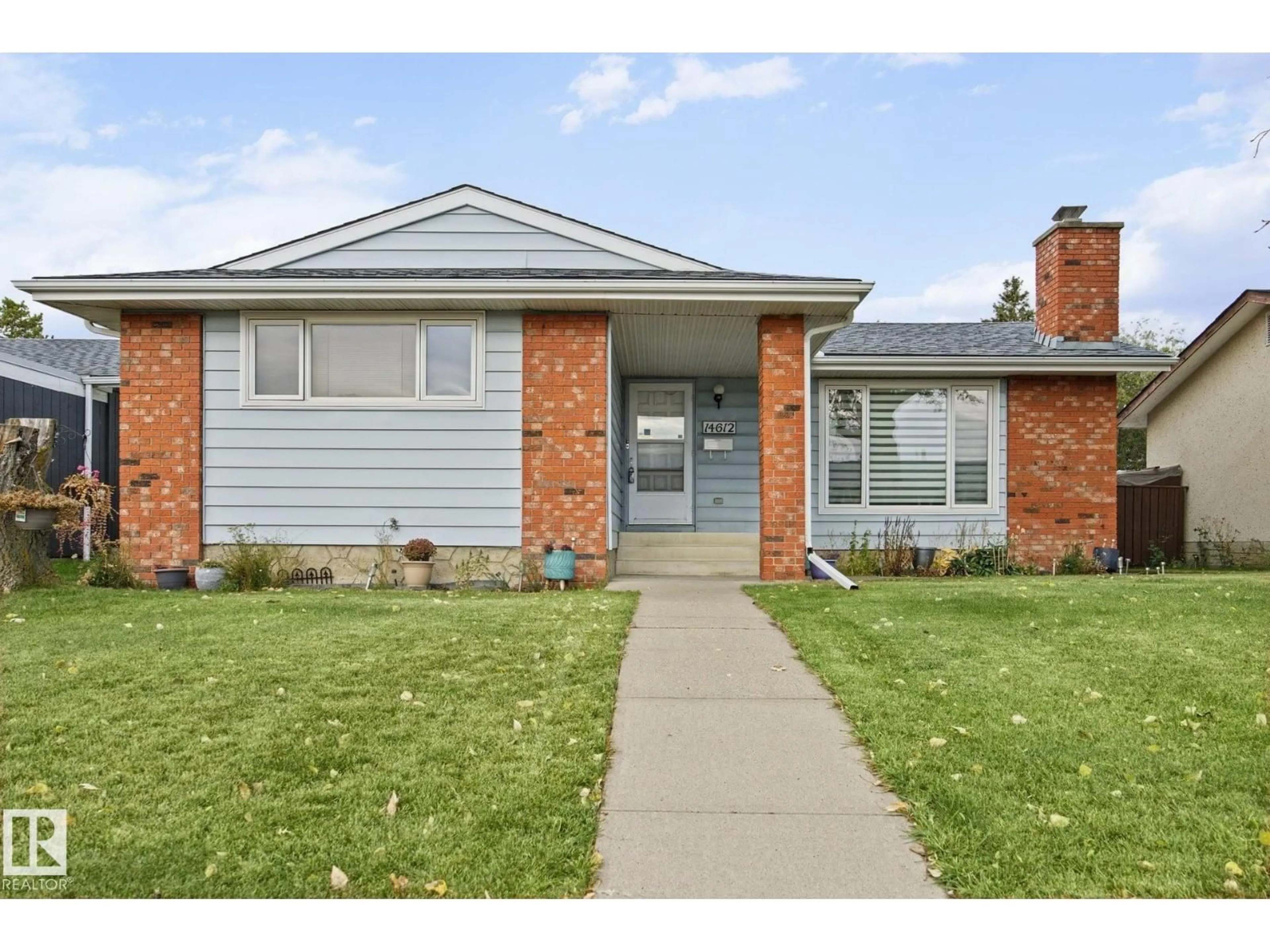 Home with brick exterior material, street for 14612 117A ST NW, Edmonton Alberta T5X1K2