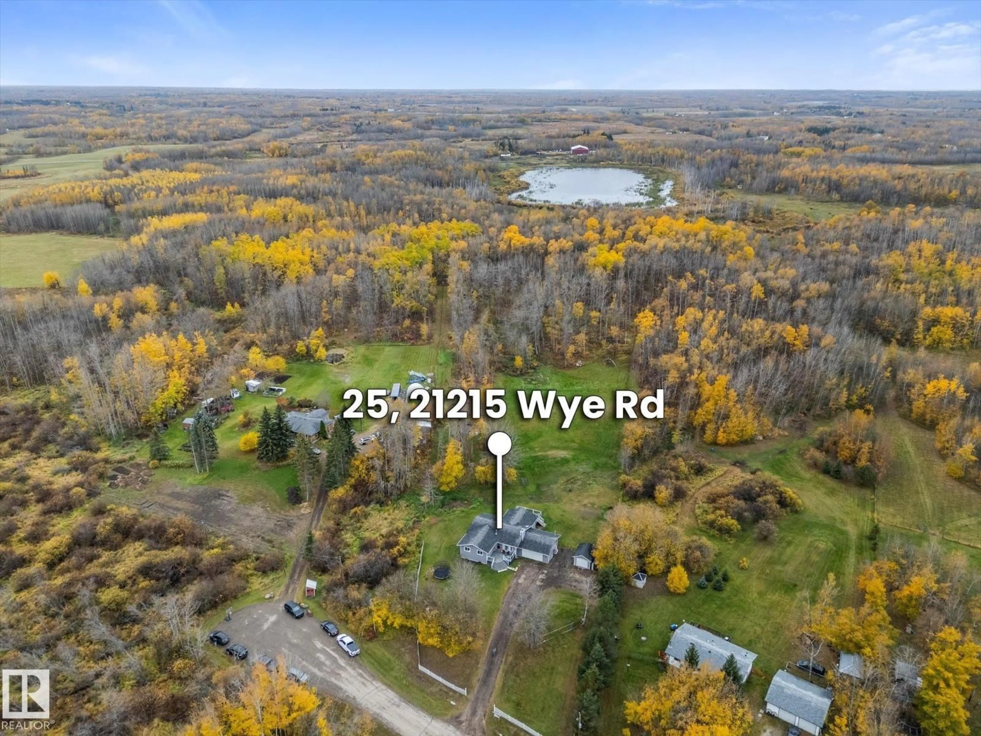 A pic from outside/outdoor area/front of a property/back of a property/a pic from drone, water/lake/river/ocean view for 21215 - 25 WYE RD, Rural Strathcona County Alberta T8L1C8