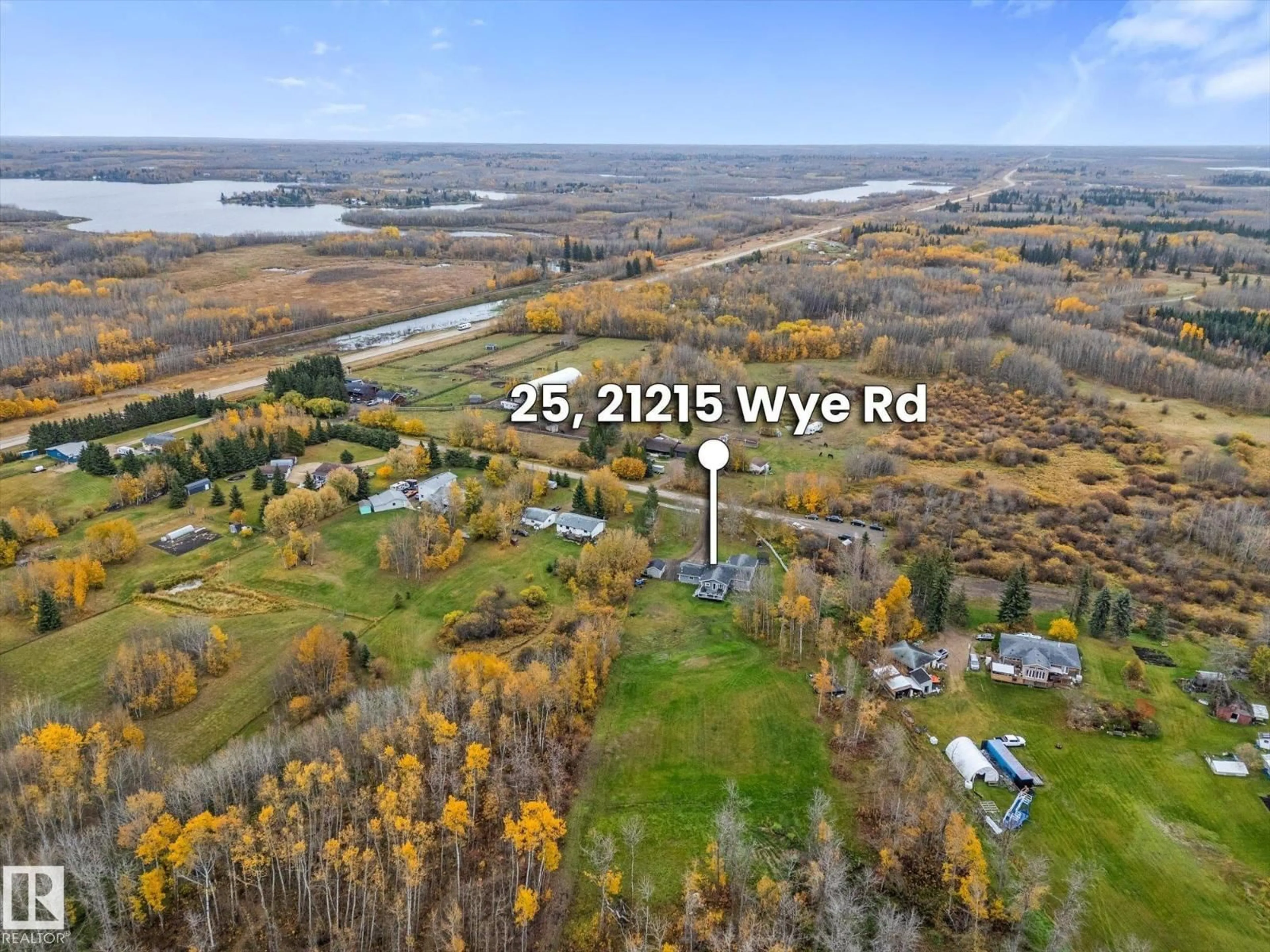 A pic from outside/outdoor area/front of a property/back of a property/a pic from drone, water/lake/river/ocean view for 21215 - 25 WYE RD, Rural Strathcona County Alberta T8L1C8