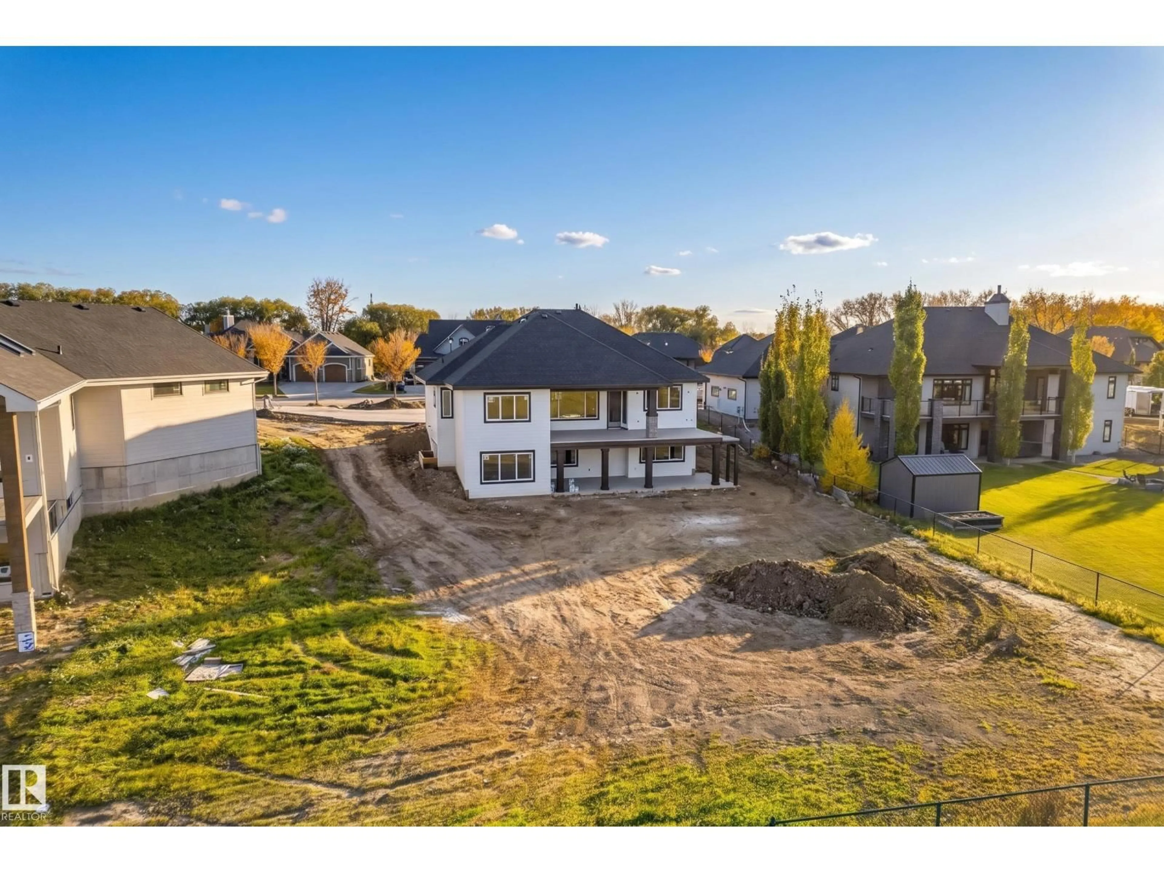 A pic from outside/outdoor area/front of a property/back of a property/a pic from drone, mountain view for 1050 GENESIS LAKE BV, Stony Plain Alberta T7Z0G3