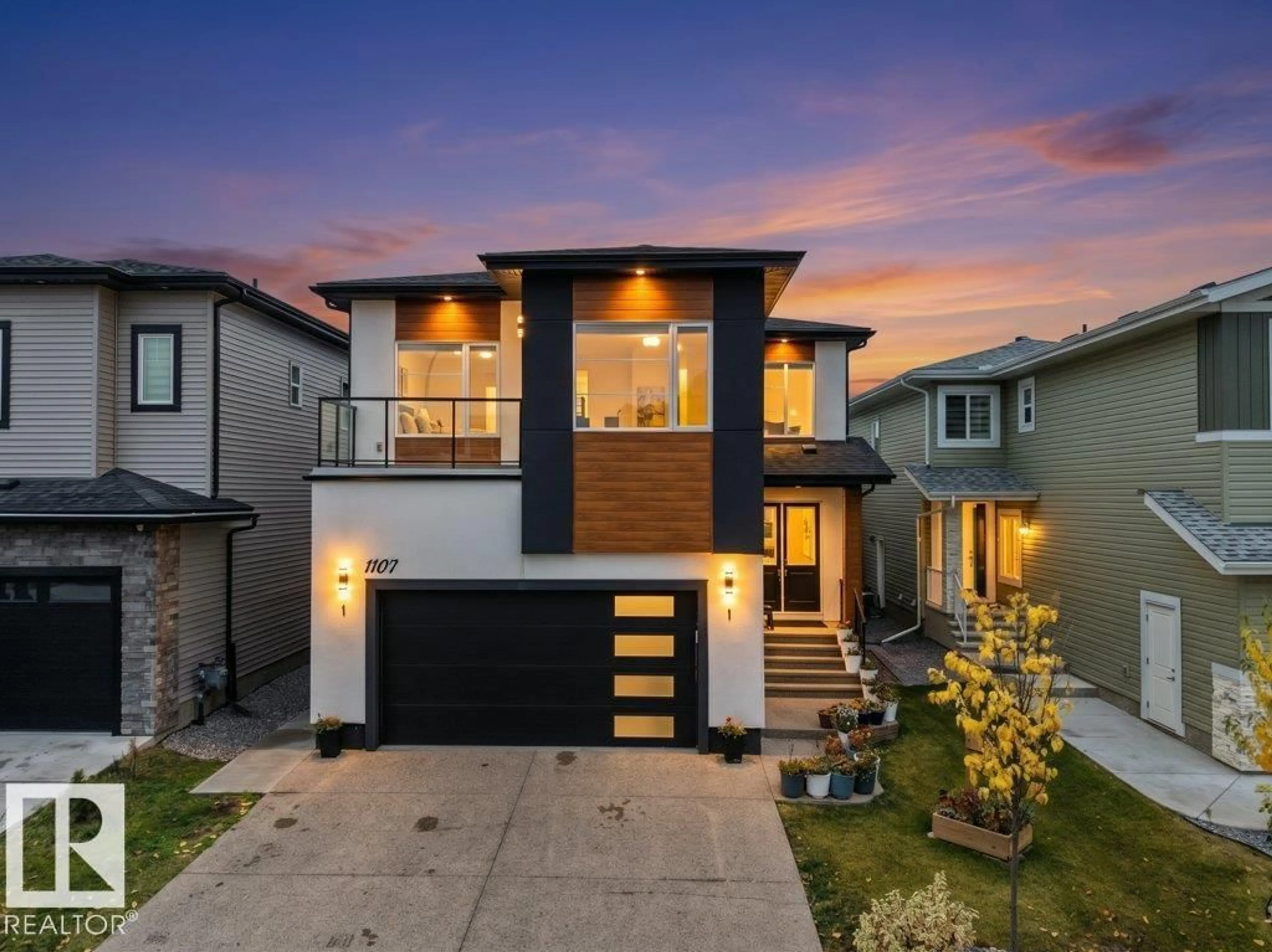 Home with brick exterior material, street for NW - 1107 150 AV, Edmonton Alberta T5Y4C1