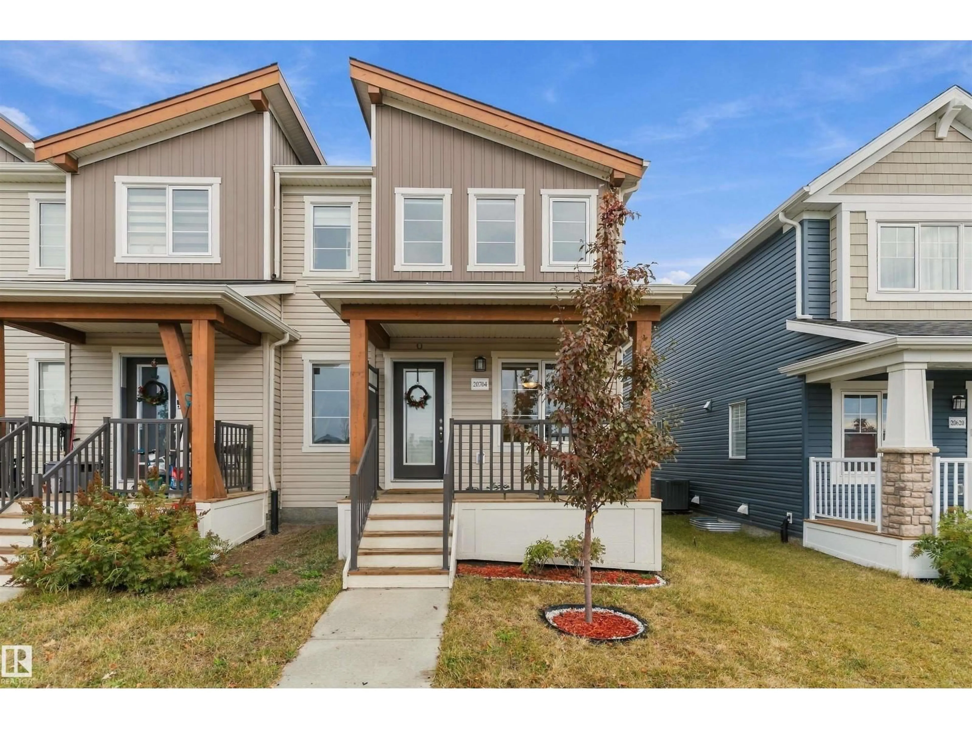 Home with vinyl exterior material, street for 20704 19 AV, Edmonton Alberta T6M1R5