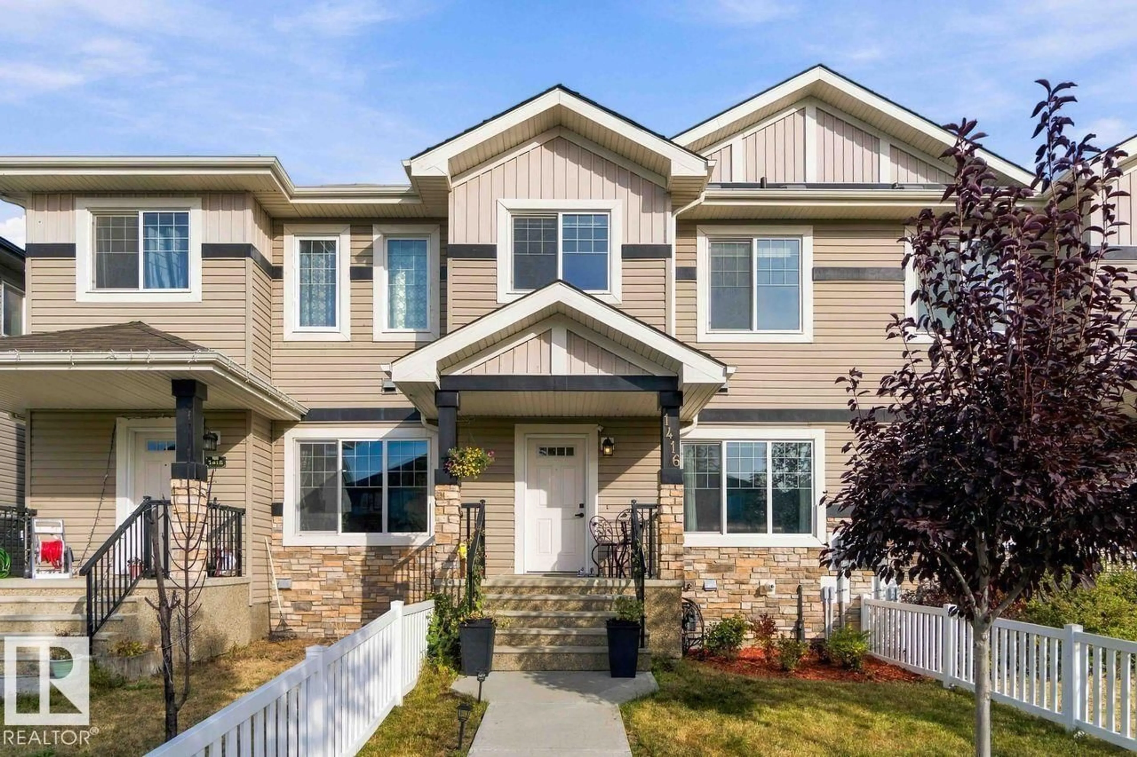 Home with vinyl exterior material, street for 1416 26 AV NW, Edmonton Alberta T6T0W1