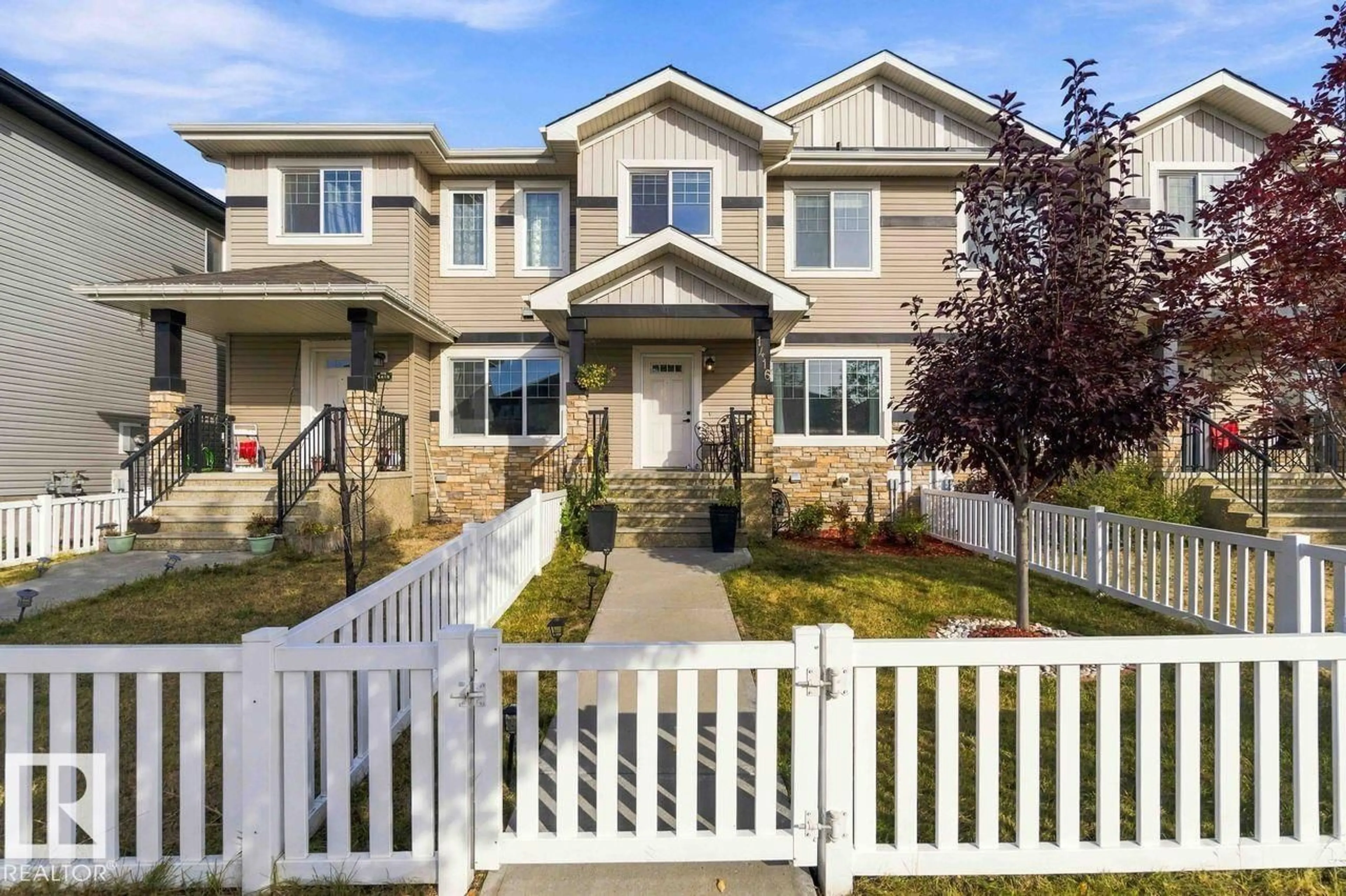 Home with vinyl exterior material, street for 1416 26 AV NW, Edmonton Alberta T6T0W1