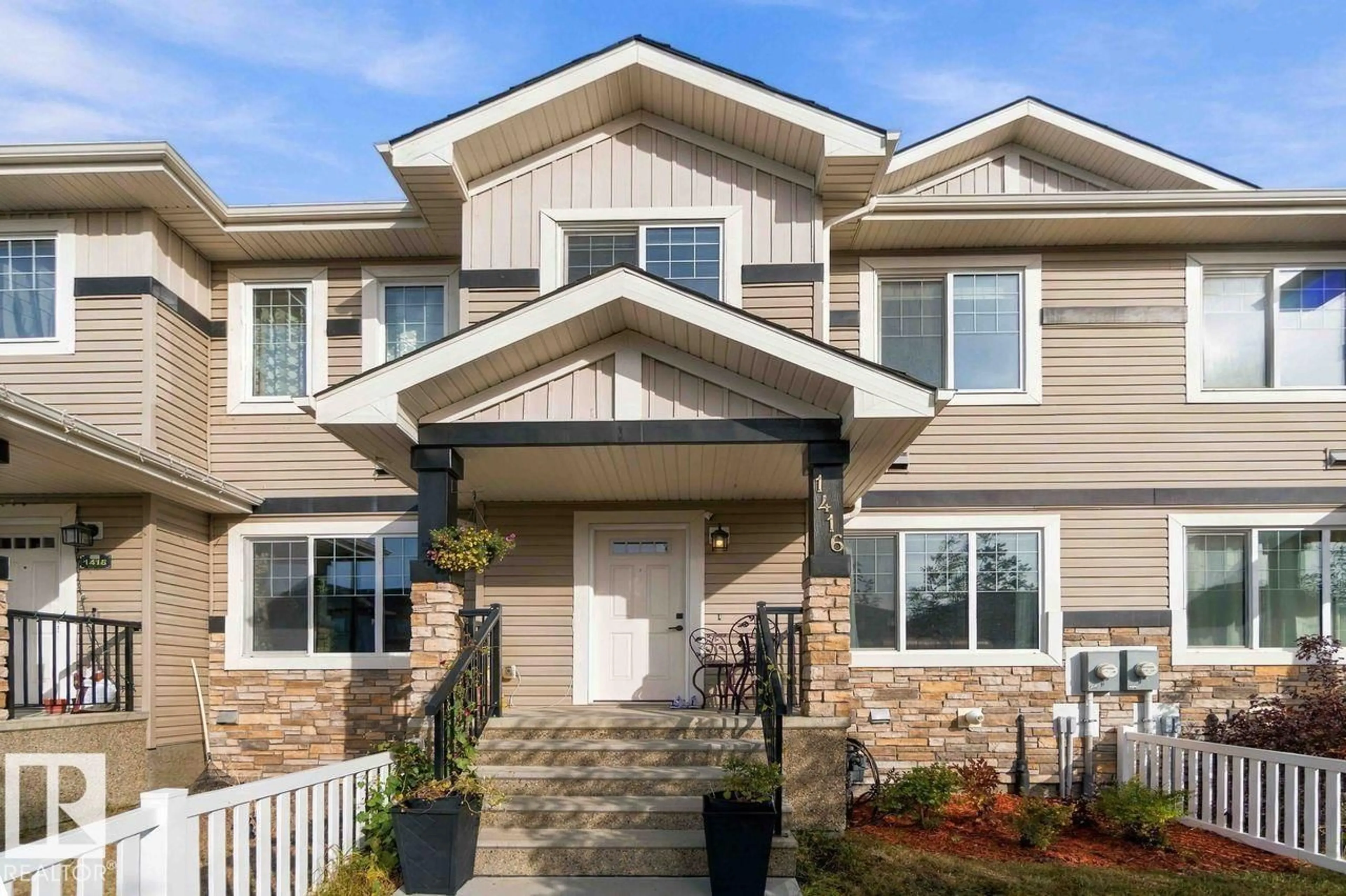 Home with vinyl exterior material, street for 1416 26 AV NW, Edmonton Alberta T6T0W1