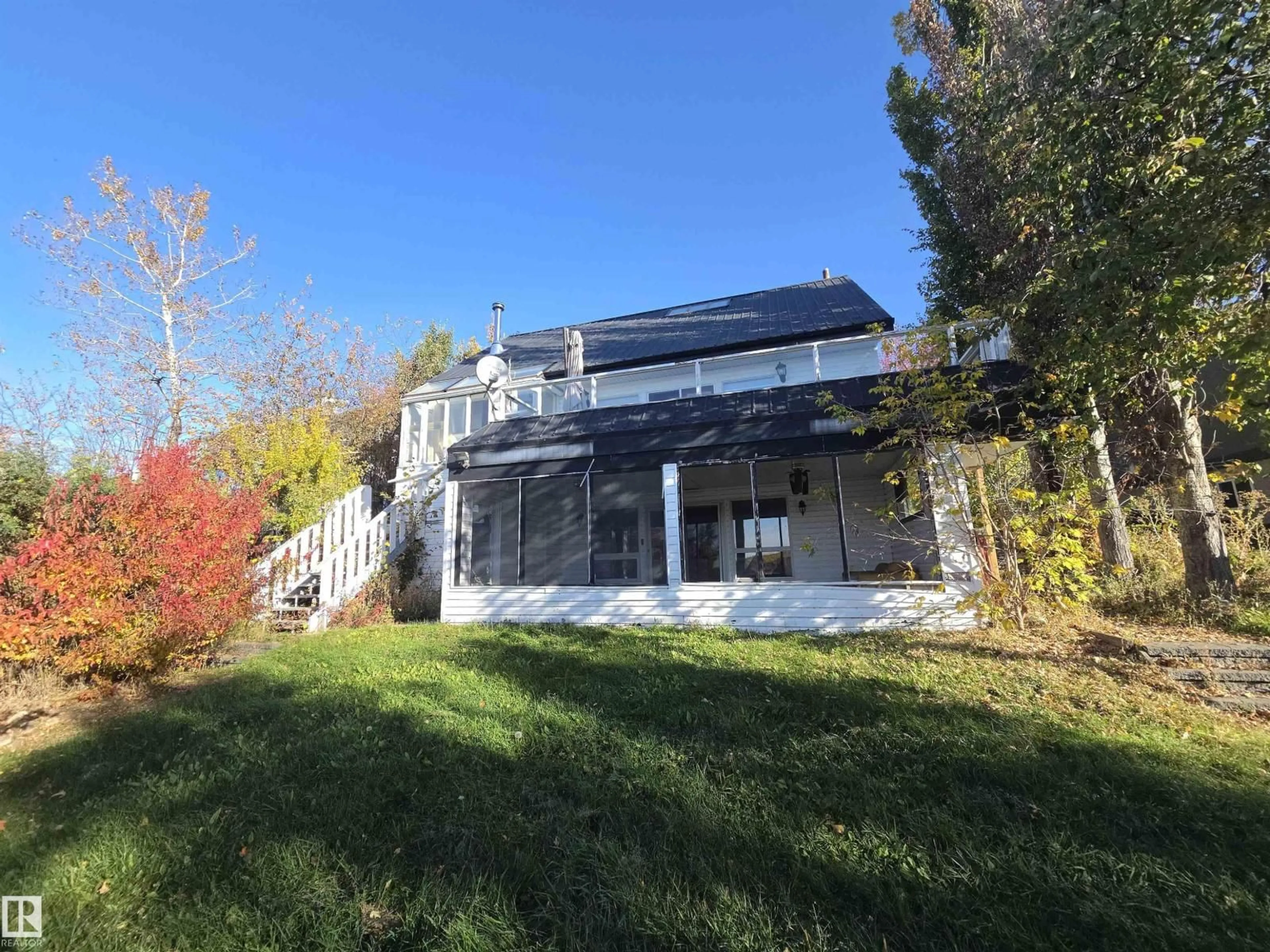 A pic from outside/outdoor area/front of a property/back of a property/a pic from drone, mountain view for #9 - 60528 RGE RD 464A, Rural Bonnyville M.D. Alberta T9N2J6
