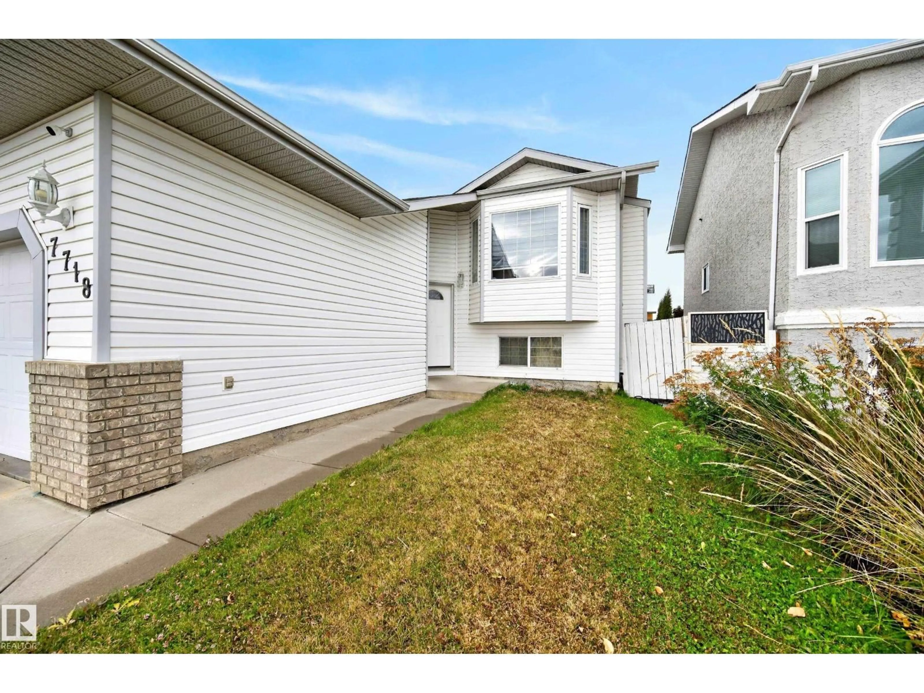 Home with vinyl exterior material, street for 7718 166A AV, Edmonton Alberta T5Z3V9