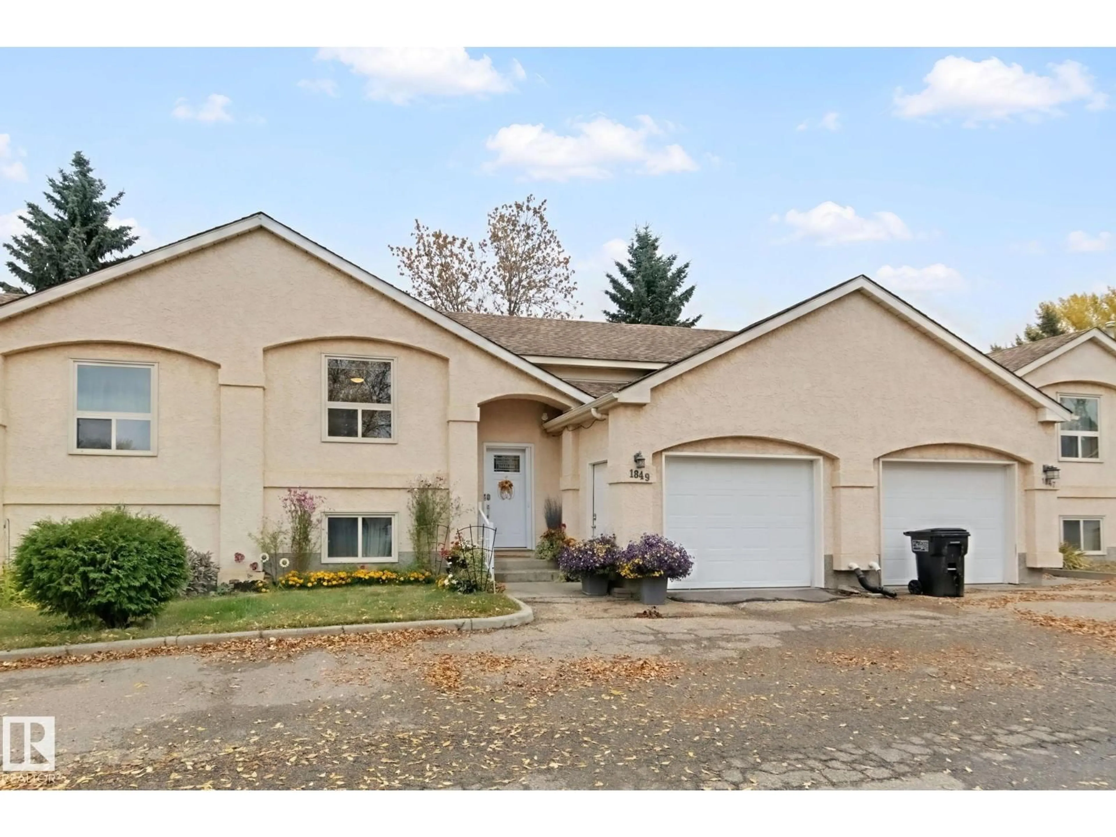 Home with vinyl exterior material, street for NW - 1849 MILL WOODS RD E, Edmonton Alberta T6L6K2