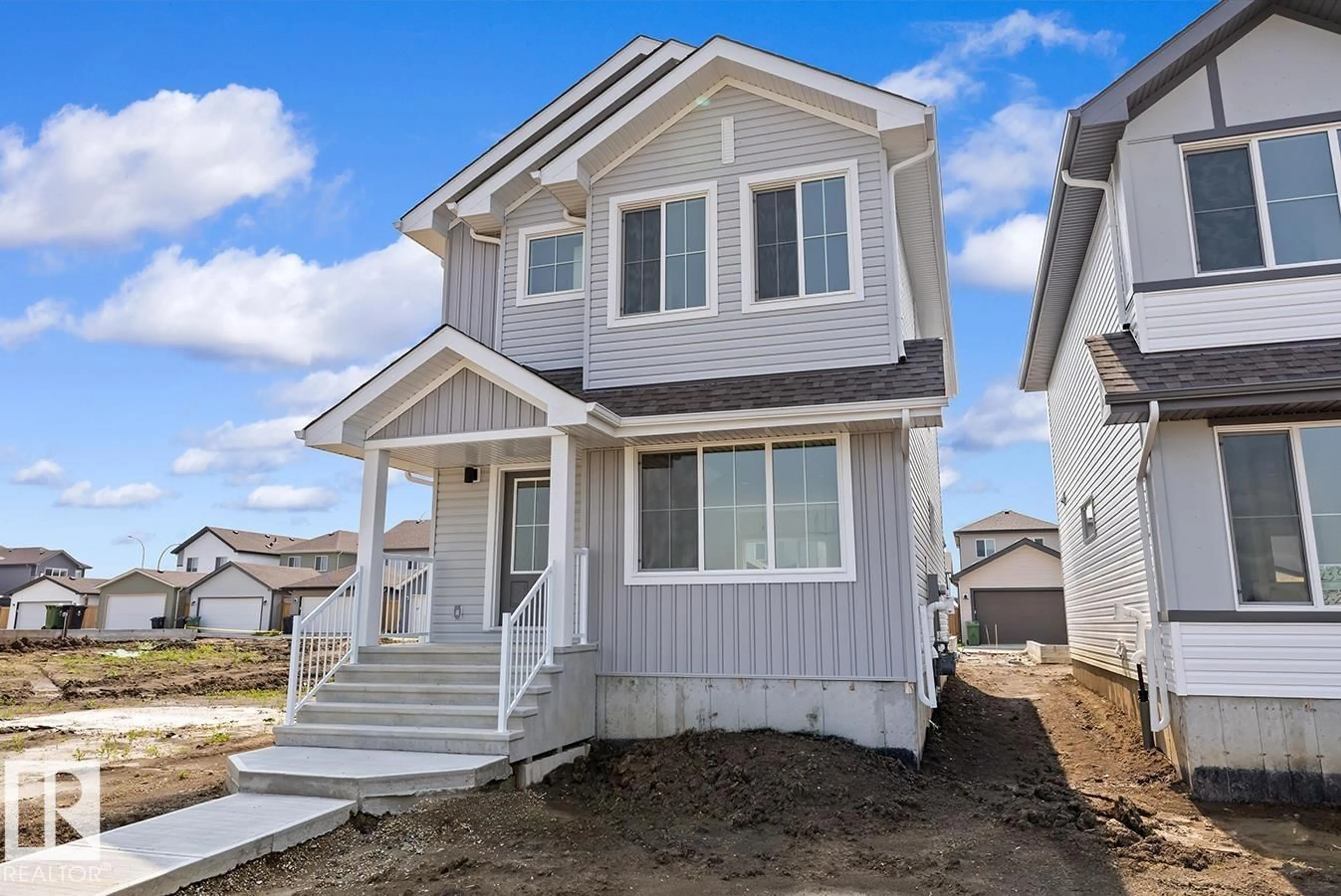 Home with vinyl exterior material, street for 127 SERENO LN, Fort Saskatchewan Alberta T8L0Z9