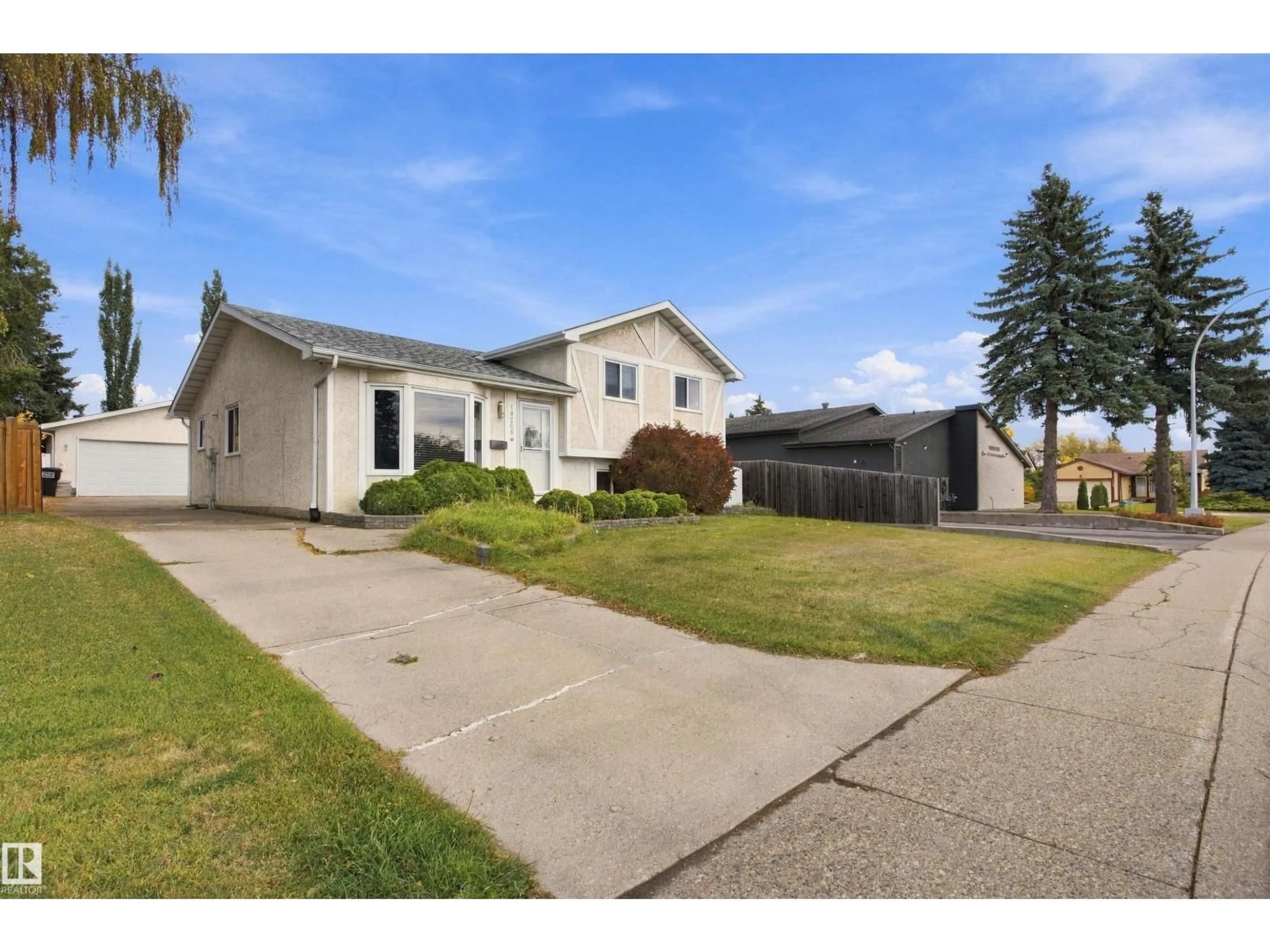 Home with vinyl exterior material, street for 18208 99 AV, Edmonton Alberta T5T3J2
