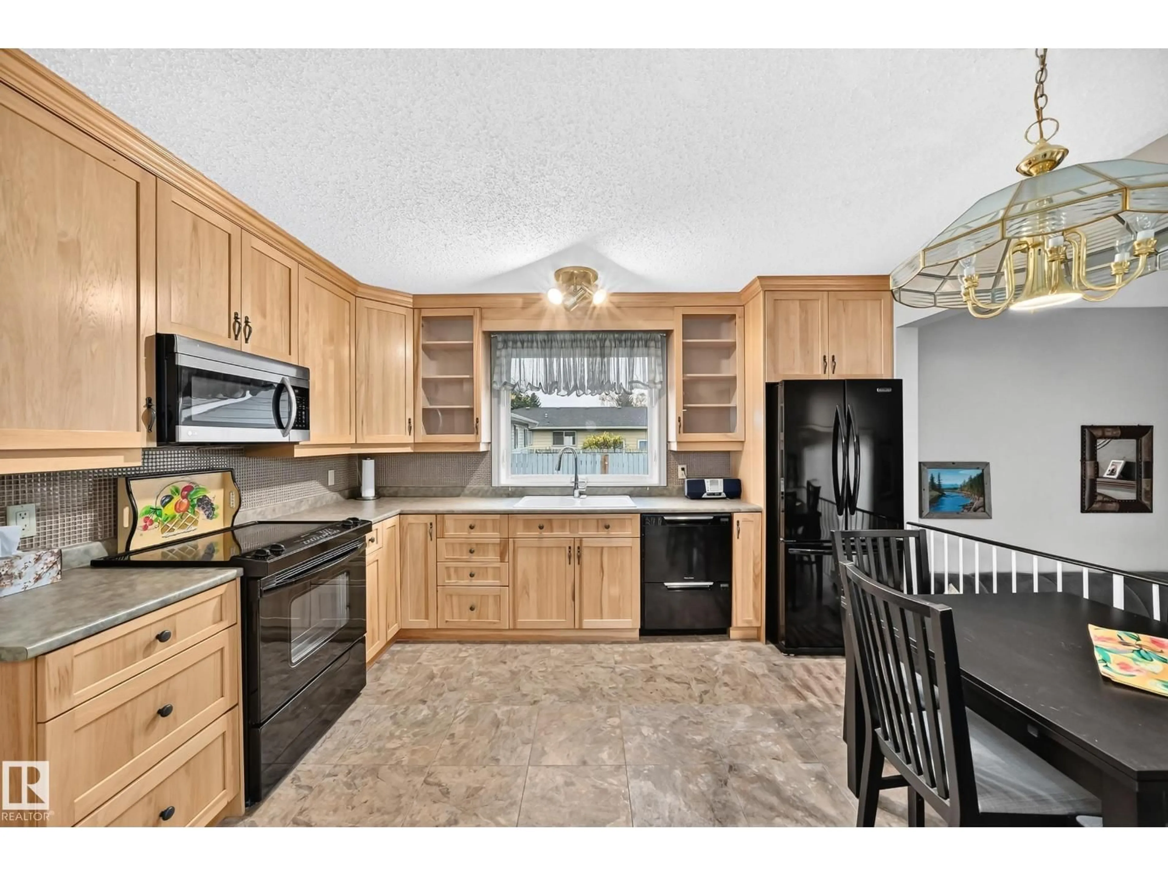 Open concept kitchen, ceramic/tile floor for 8612 176 ST, Edmonton Alberta T5T0N3