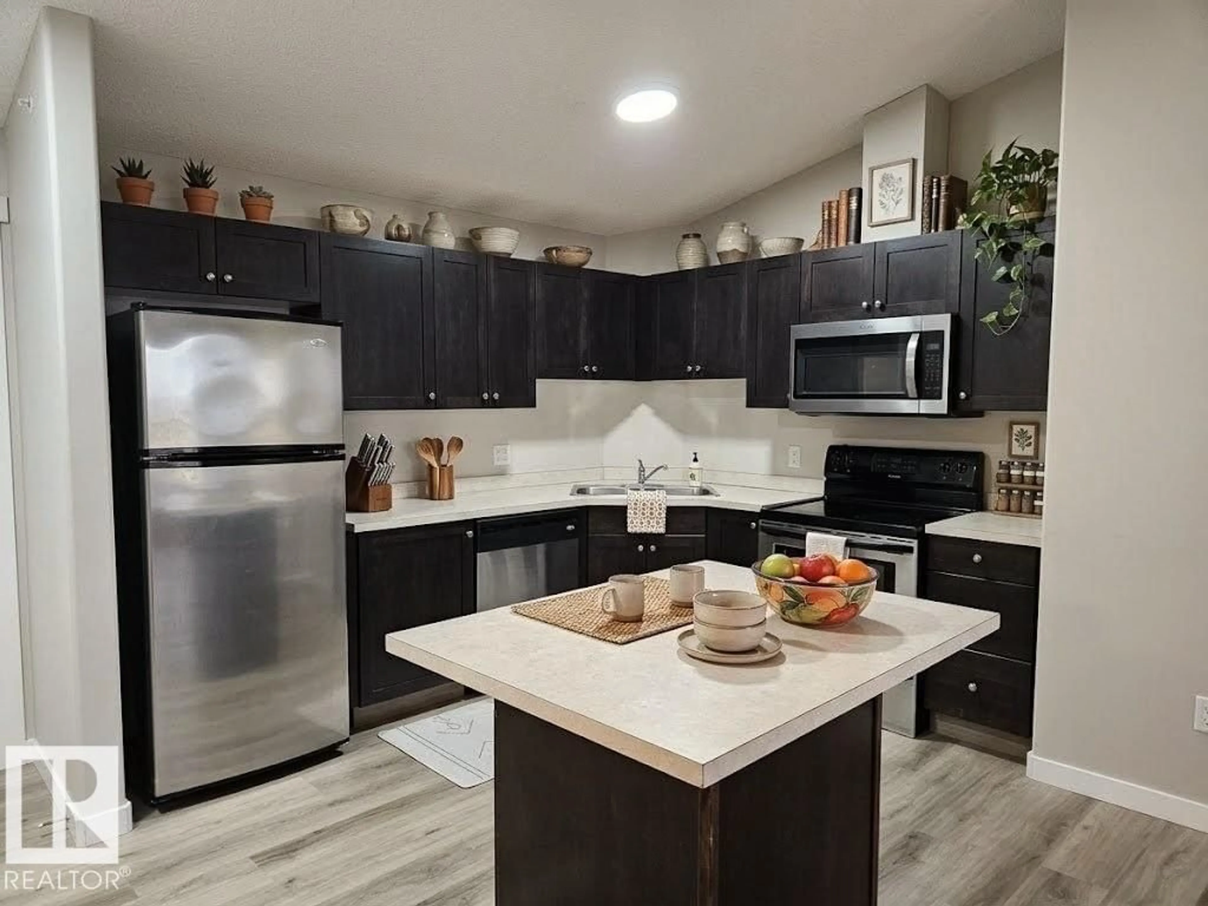 Open concept kitchen, unknown for 9363 NW - 1411 SIMPSON DR, Edmonton Alberta T6R0N2