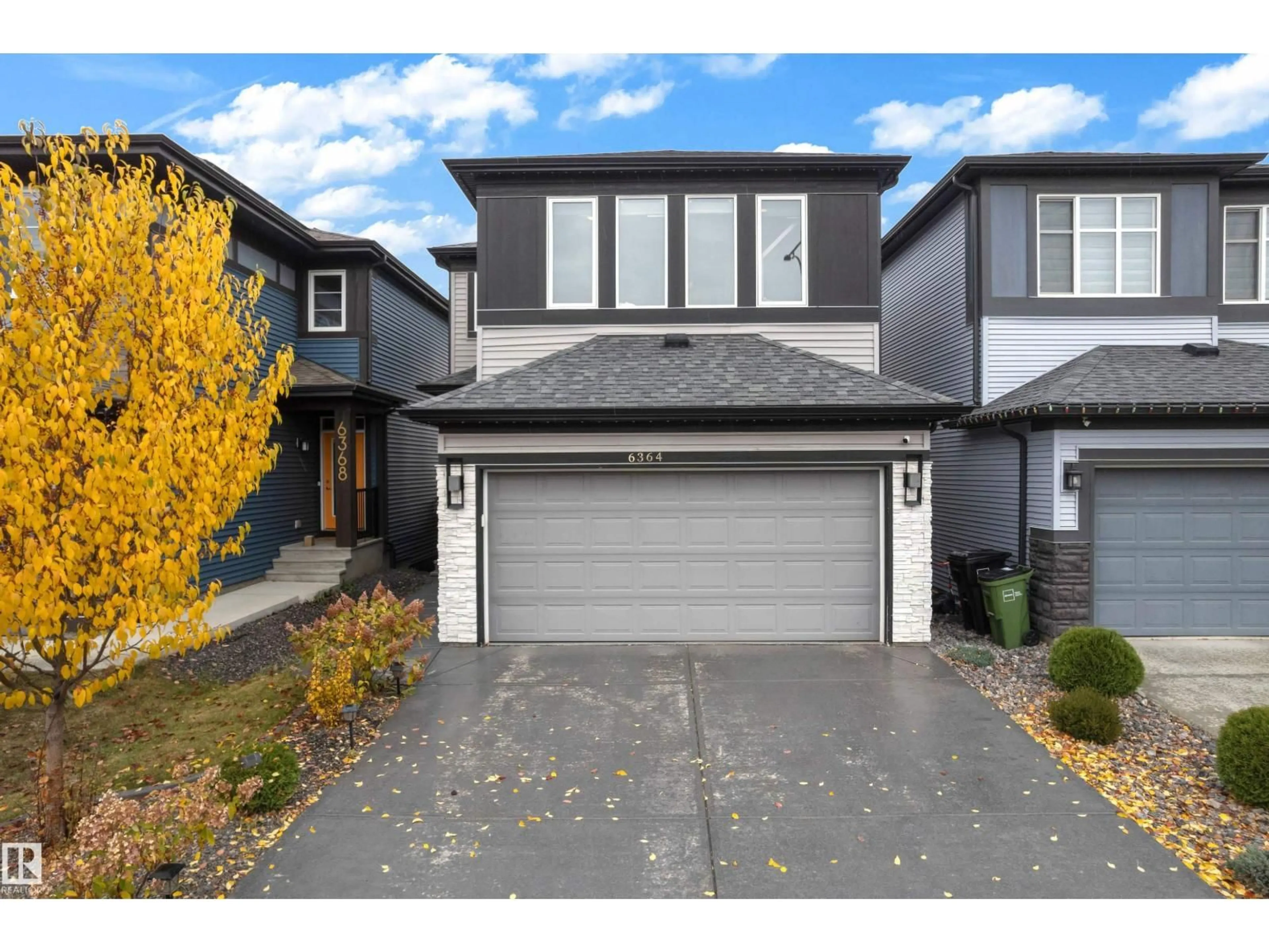 Home with vinyl exterior material, street for 6364 174 AV, Edmonton Alberta T5Y3Y3