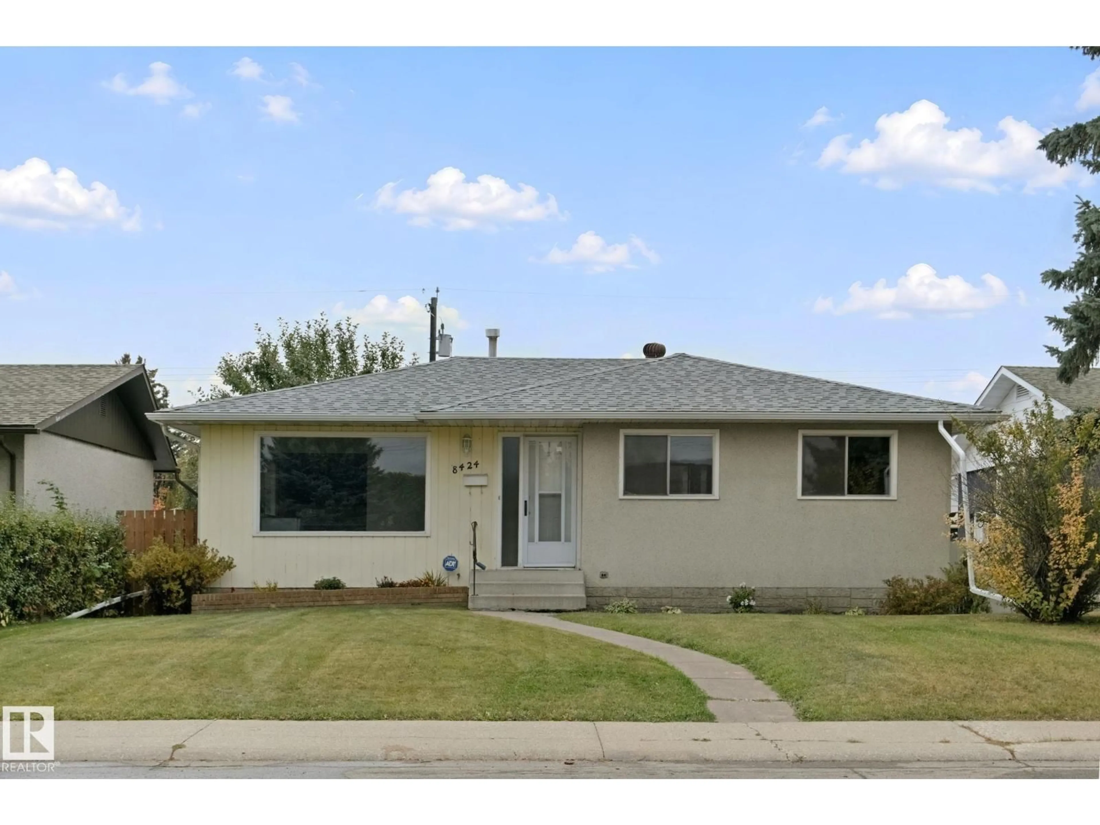 Home with vinyl exterior material, street for NW - 8424 70 ST, Edmonton Alberta T6B1W5