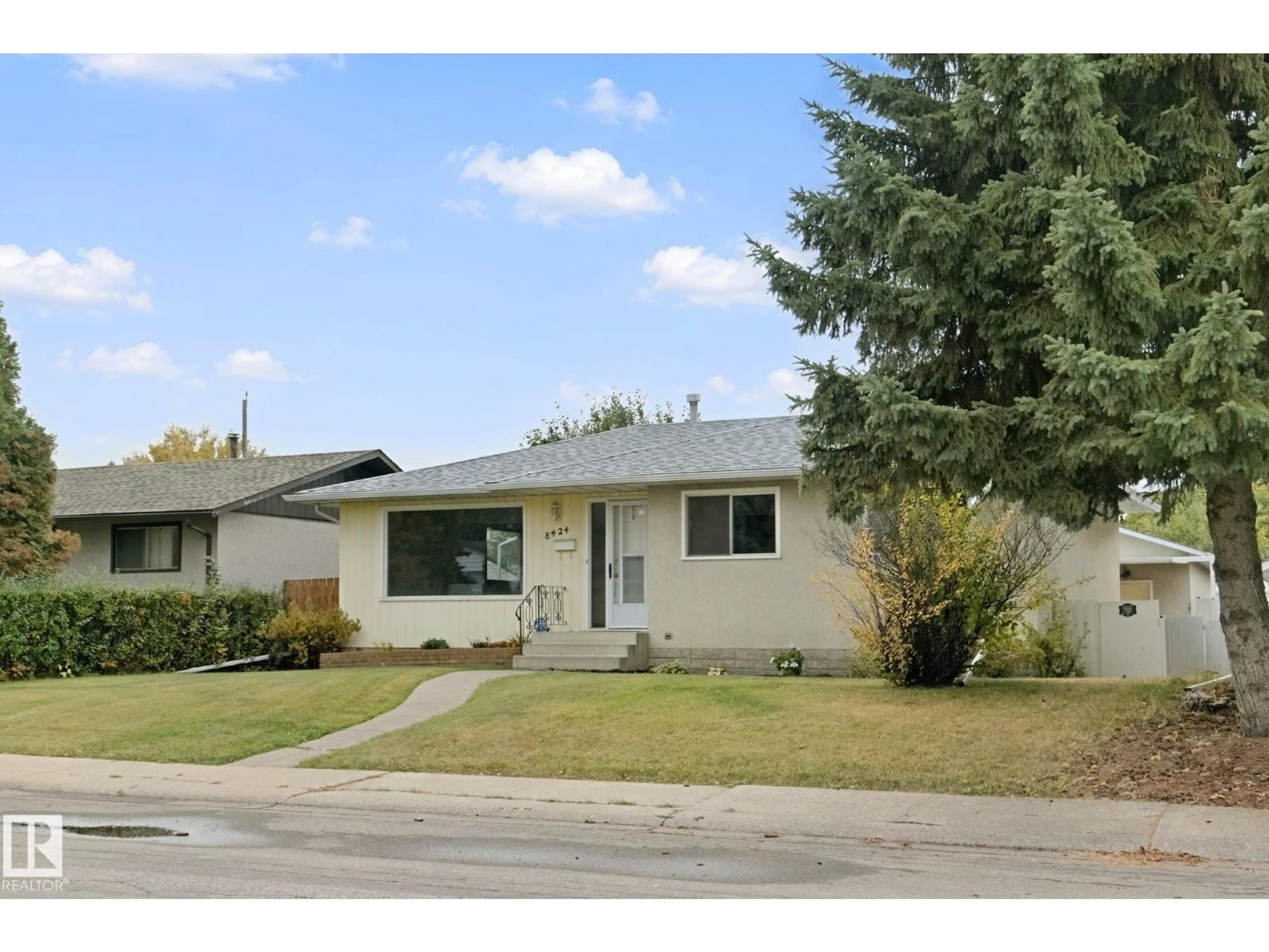 Home with vinyl exterior material, street for NW - 8424 70 ST, Edmonton Alberta T6B1W5