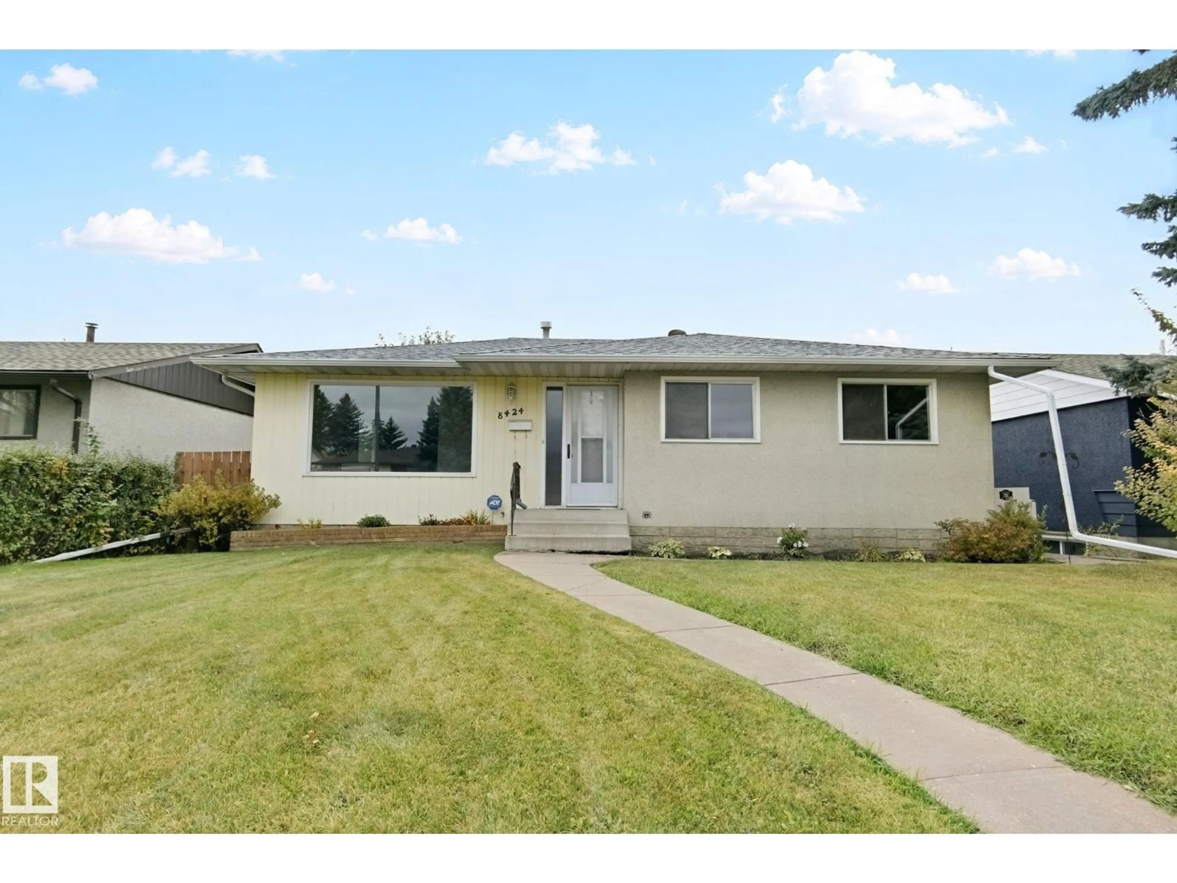 Home with vinyl exterior material, street for NW - 8424 70 ST, Edmonton Alberta T6B1W5