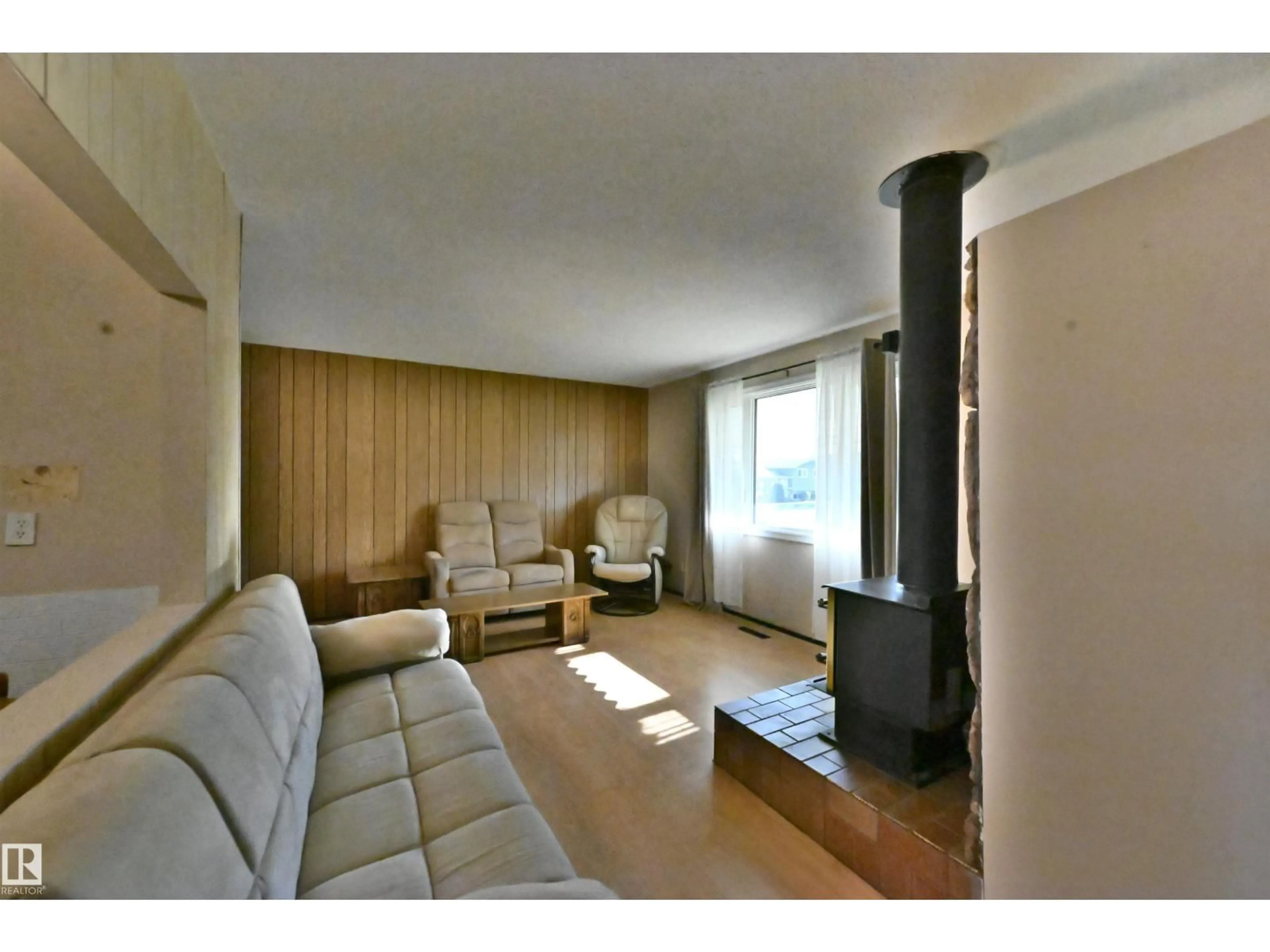 Living room with furniture, wood/laminate floor for 5014 54 AV, Leduc Alberta T9E5L5