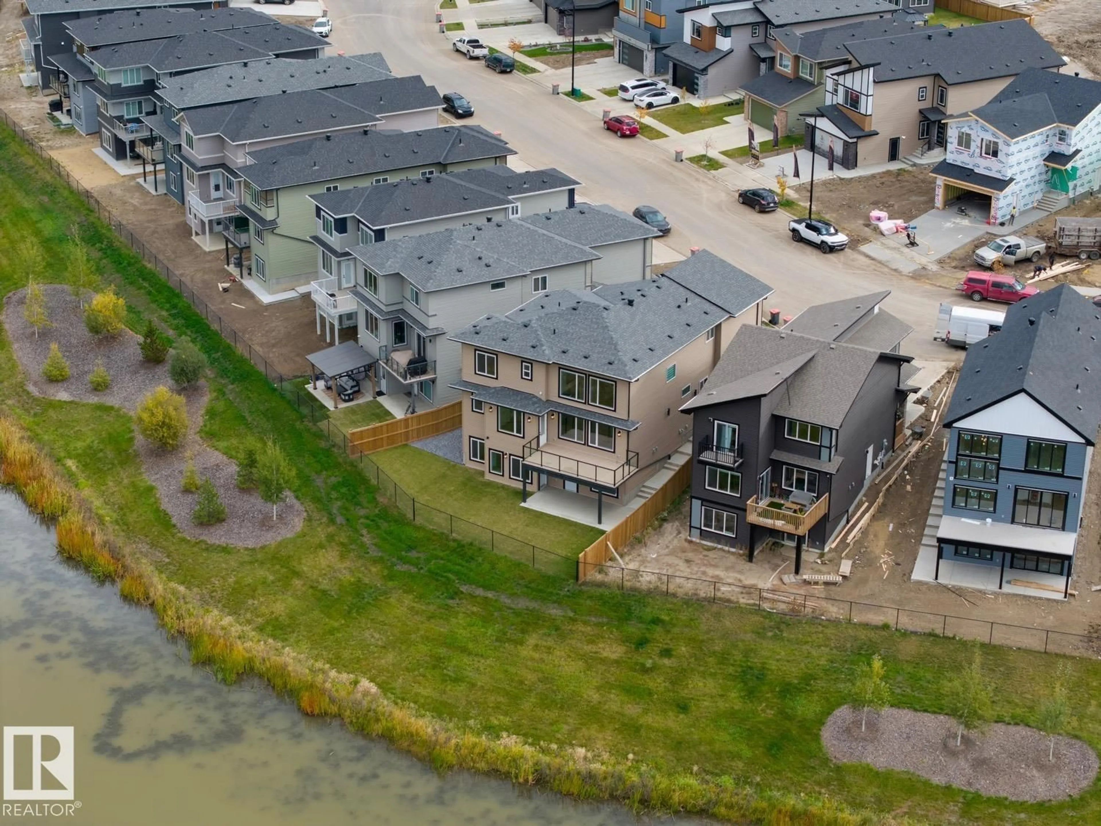A pic from outside/outdoor area/front of a property/back of a property/a pic from drone, water/lake/river/ocean view for NE - 6362 17 ST, Rural Leduc County Alberta T4X3C7