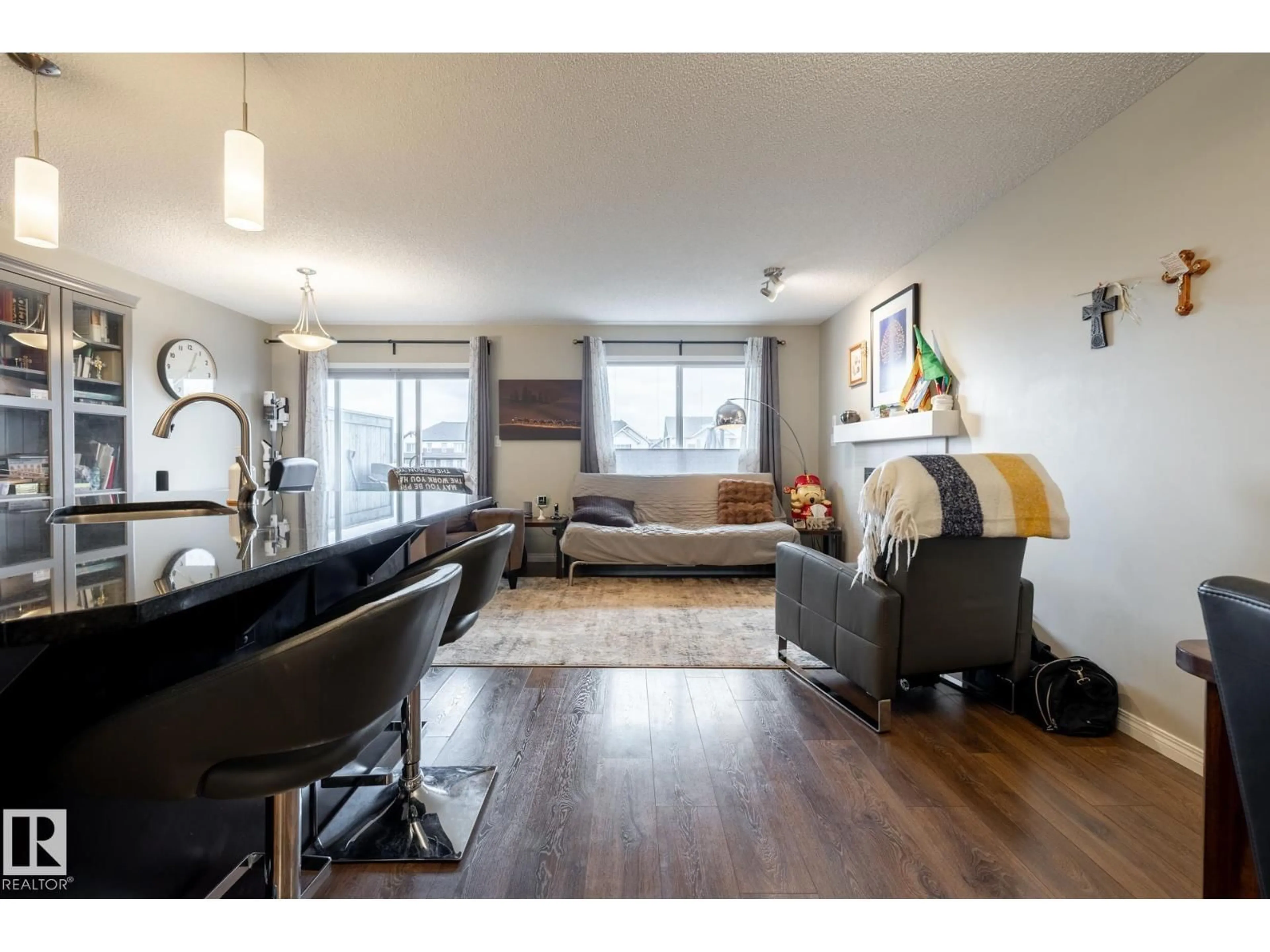 Living room with furniture, wood/laminate floor for 2093 CHALMERS WY, Edmonton Alberta T6W2E9