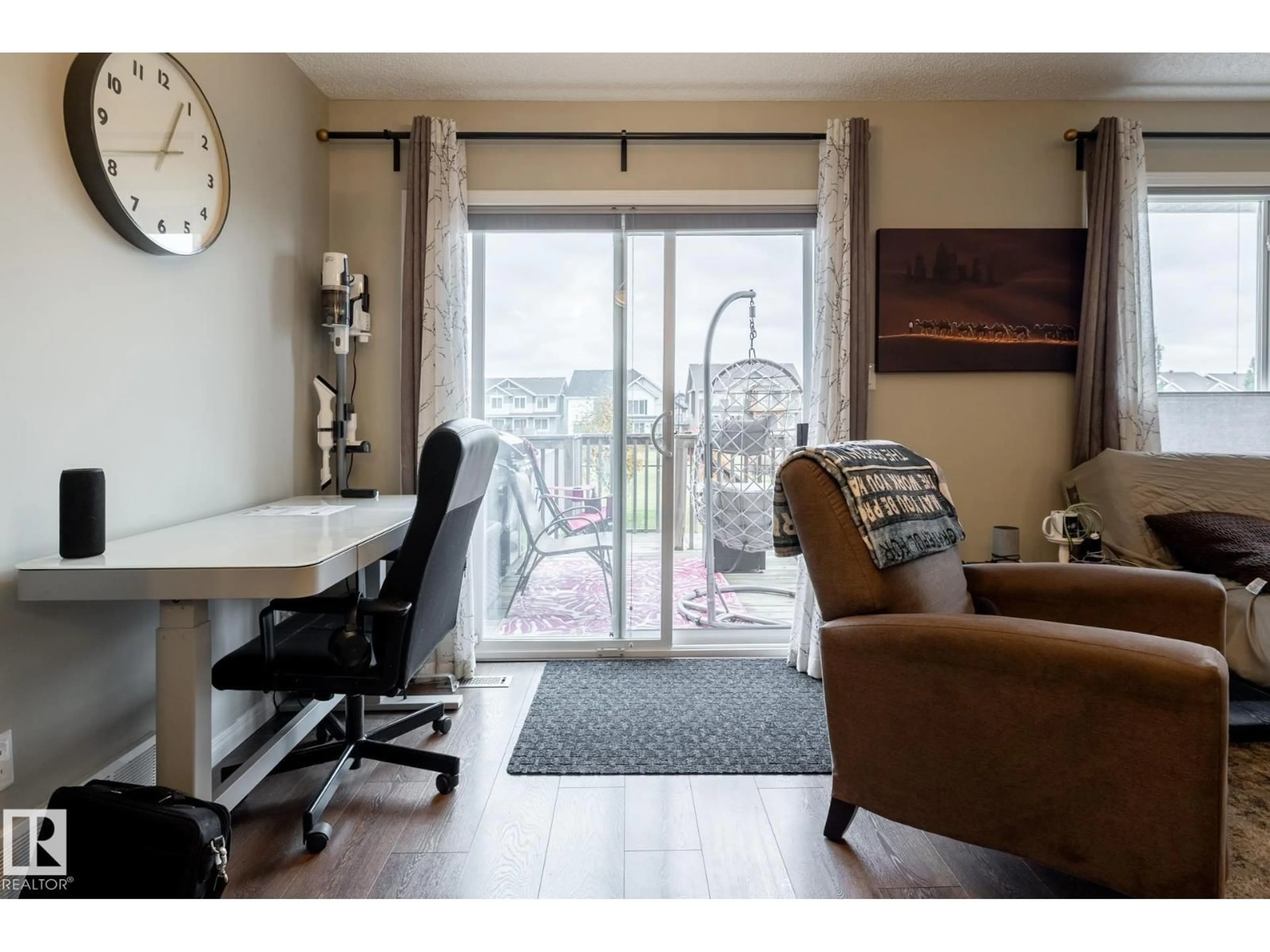Living room with furniture, wood/laminate floor for 2093 CHALMERS WY, Edmonton Alberta T6W2E9
