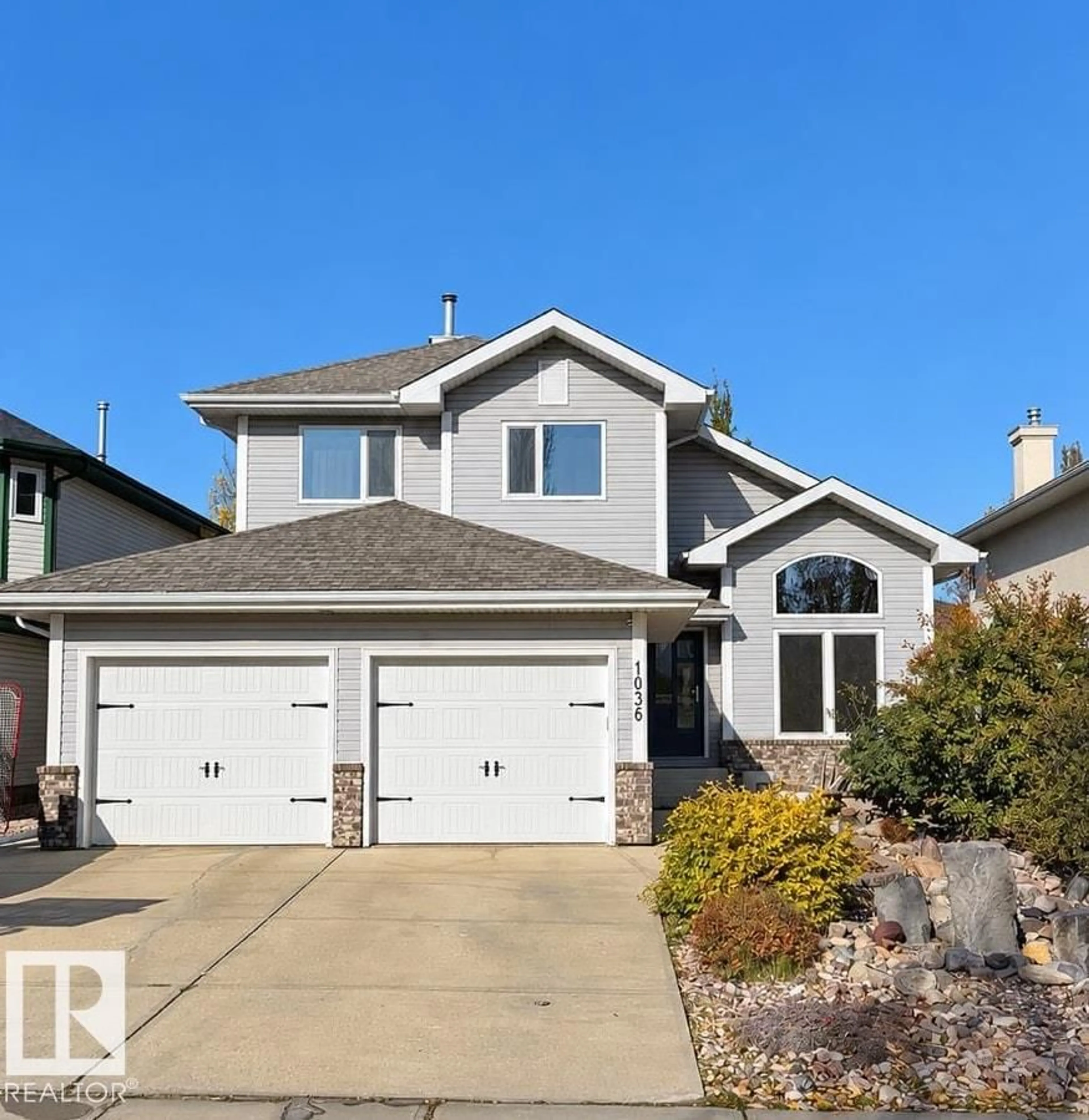 Home with vinyl exterior material, street for 1036 HOLGATE PL, Edmonton Alberta T6R2T7